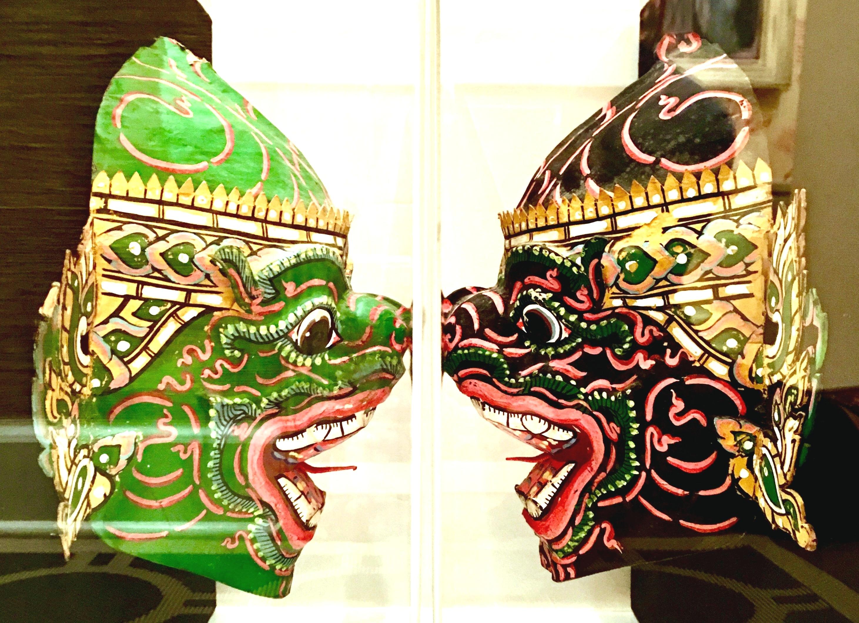 Hand-Painted Pair of 20th Century Lucite Shadow Box Mounted Hand Painted Tribal Masks For Sale