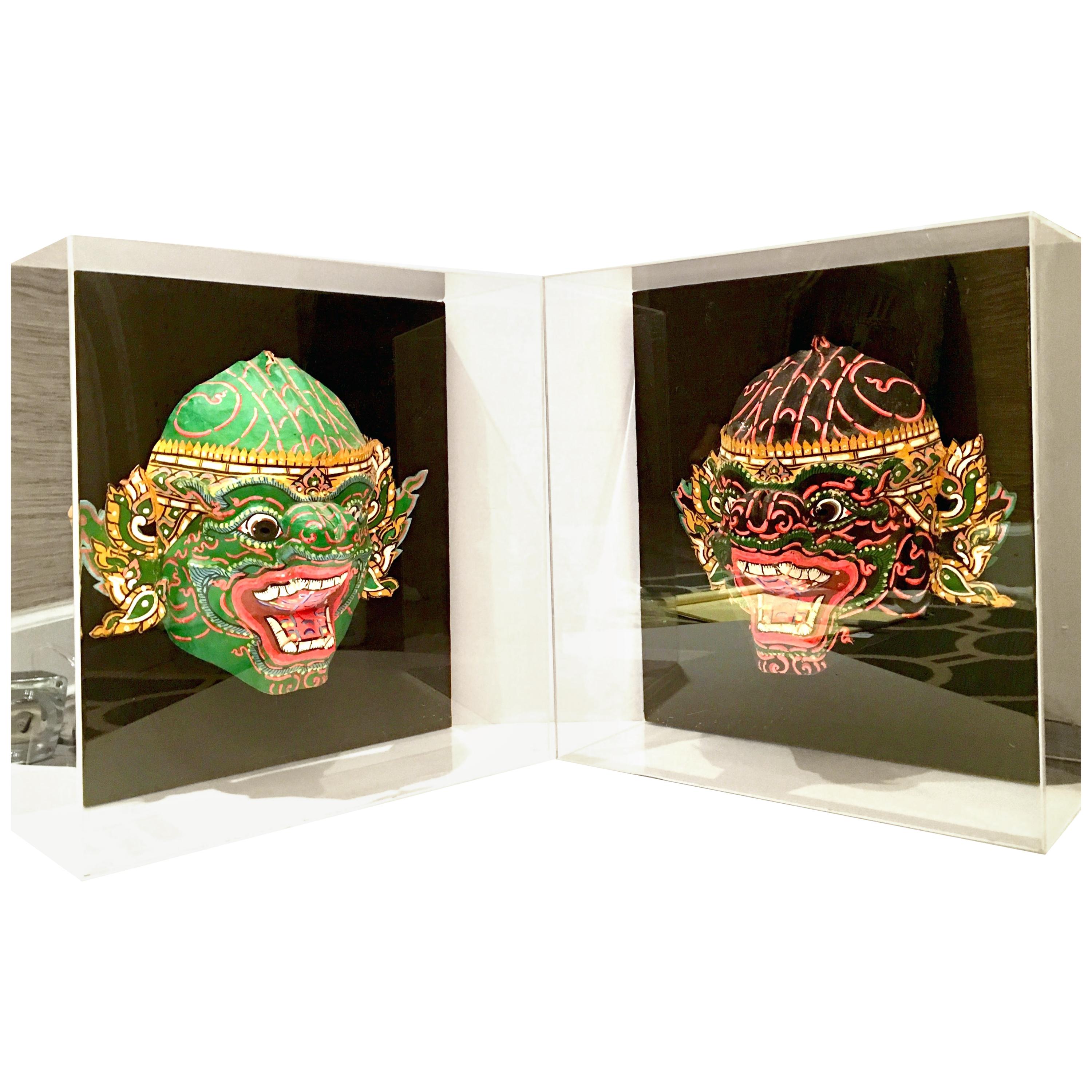 Pair of 20th Century Lucite Shadow Box Mounted Hand Painted Tribal Masks For Sale