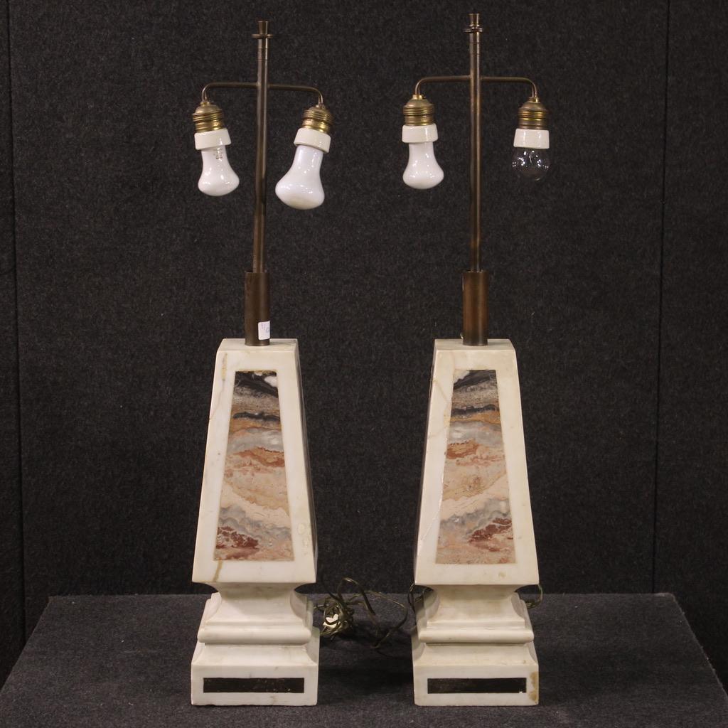 Beautiful pair of 20th century Italian lamps. Objects in white marble with polychrome inserts, finished for the center, in a beautiful patina. Lamps with two lights each, electrified with non-functioning electrical system, to be serviced. Marbles