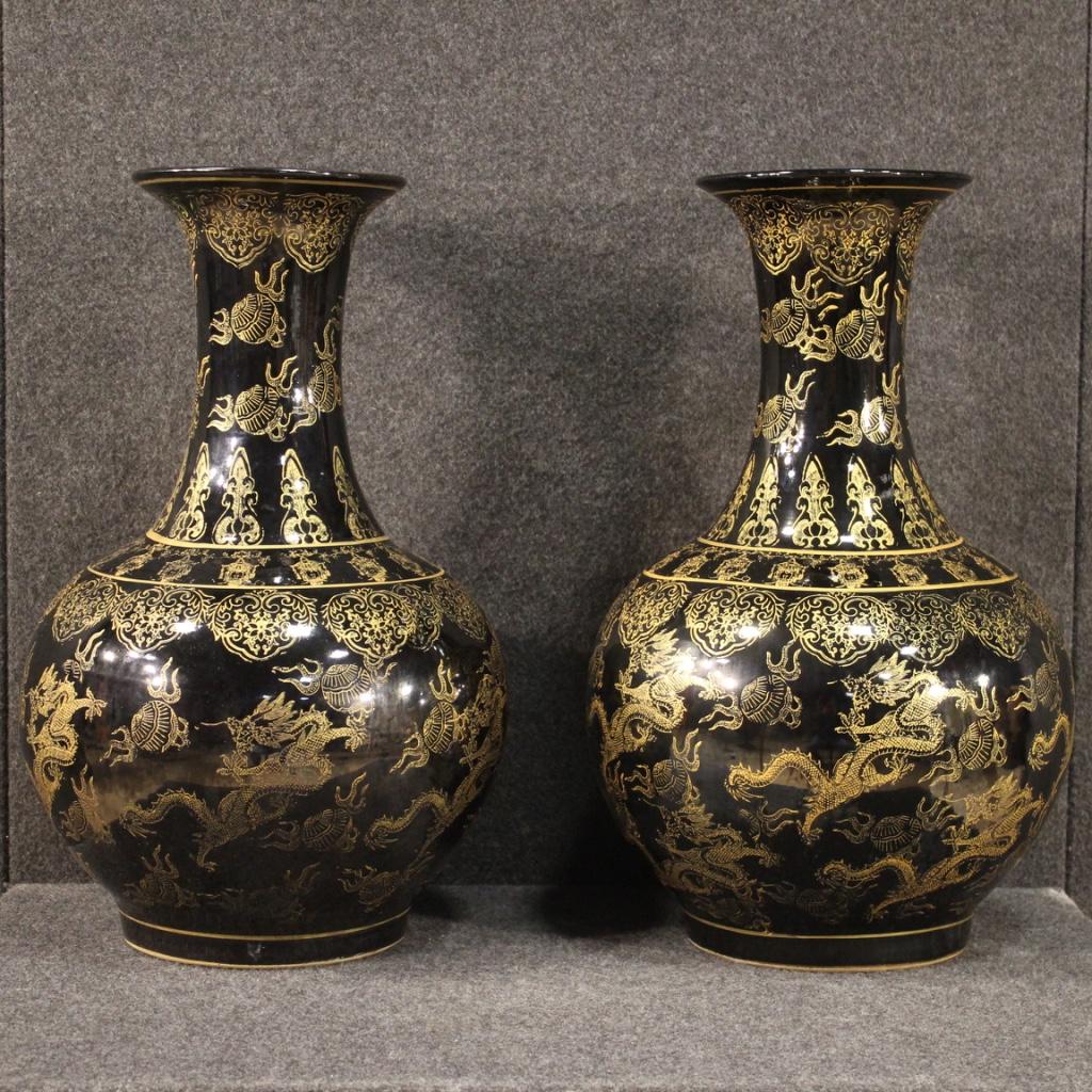Pair of great 20th century Chinese vases. Glazed and hand painted ceramic objects with golden decorations of beautiful quality and important measure. Vases for antique dealers, interior decorators and collectors with a signature under the base (see