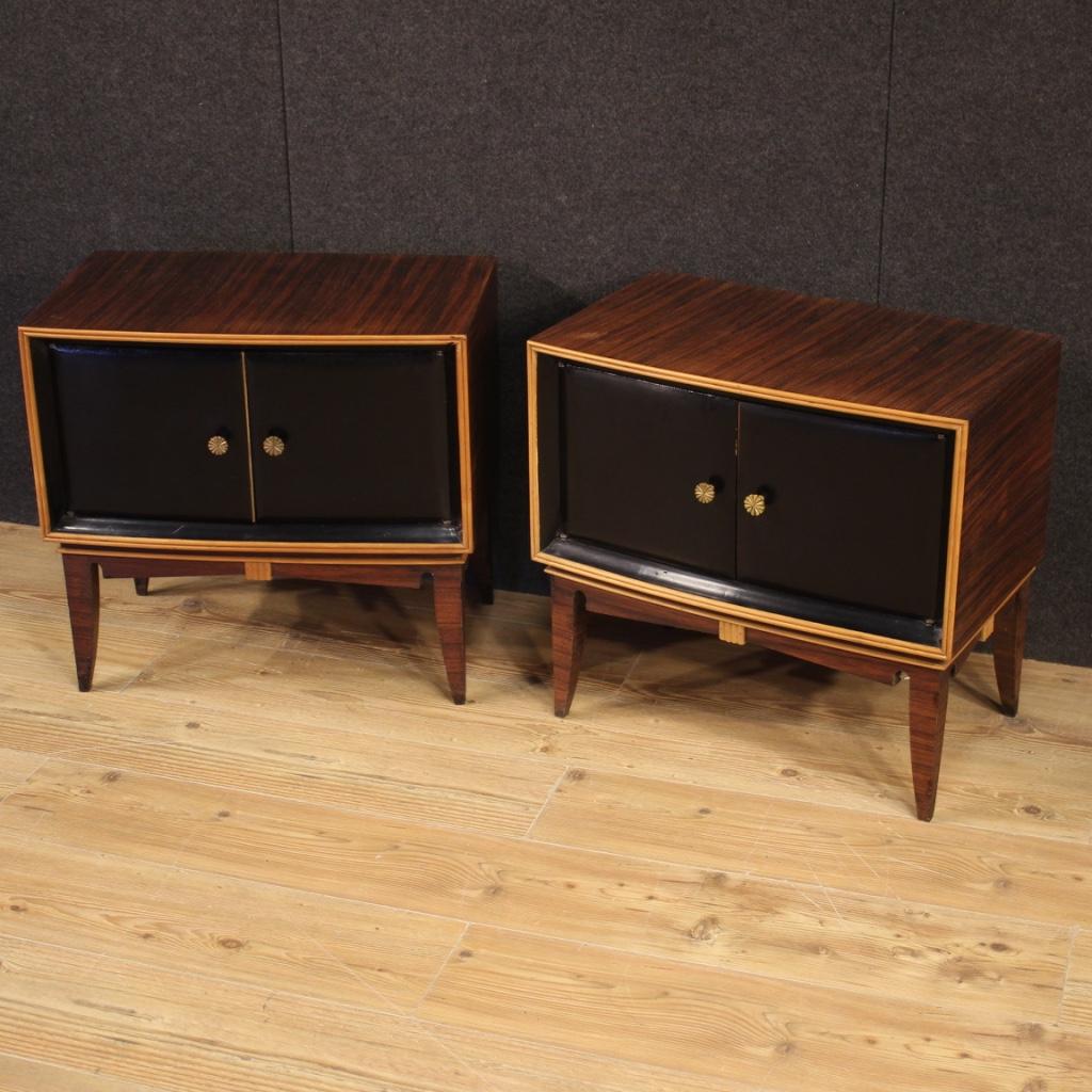 Pair of Italian design bedside tables from the 1960s. Palisander, exotic and ebonized wood furniture of beautiful lines and pleasant decor. Bedside tables of good size and proportion, with two doors, equipped with two internal compartments (see