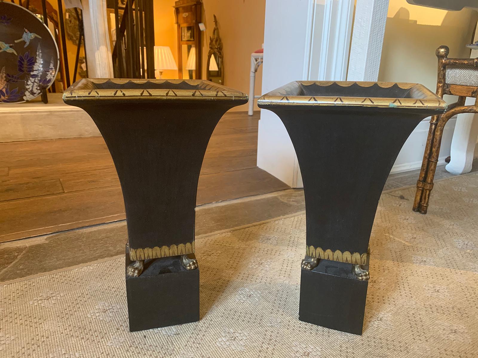 Pair of 20th century Palladio style black painted & gilt wooden cachepots.