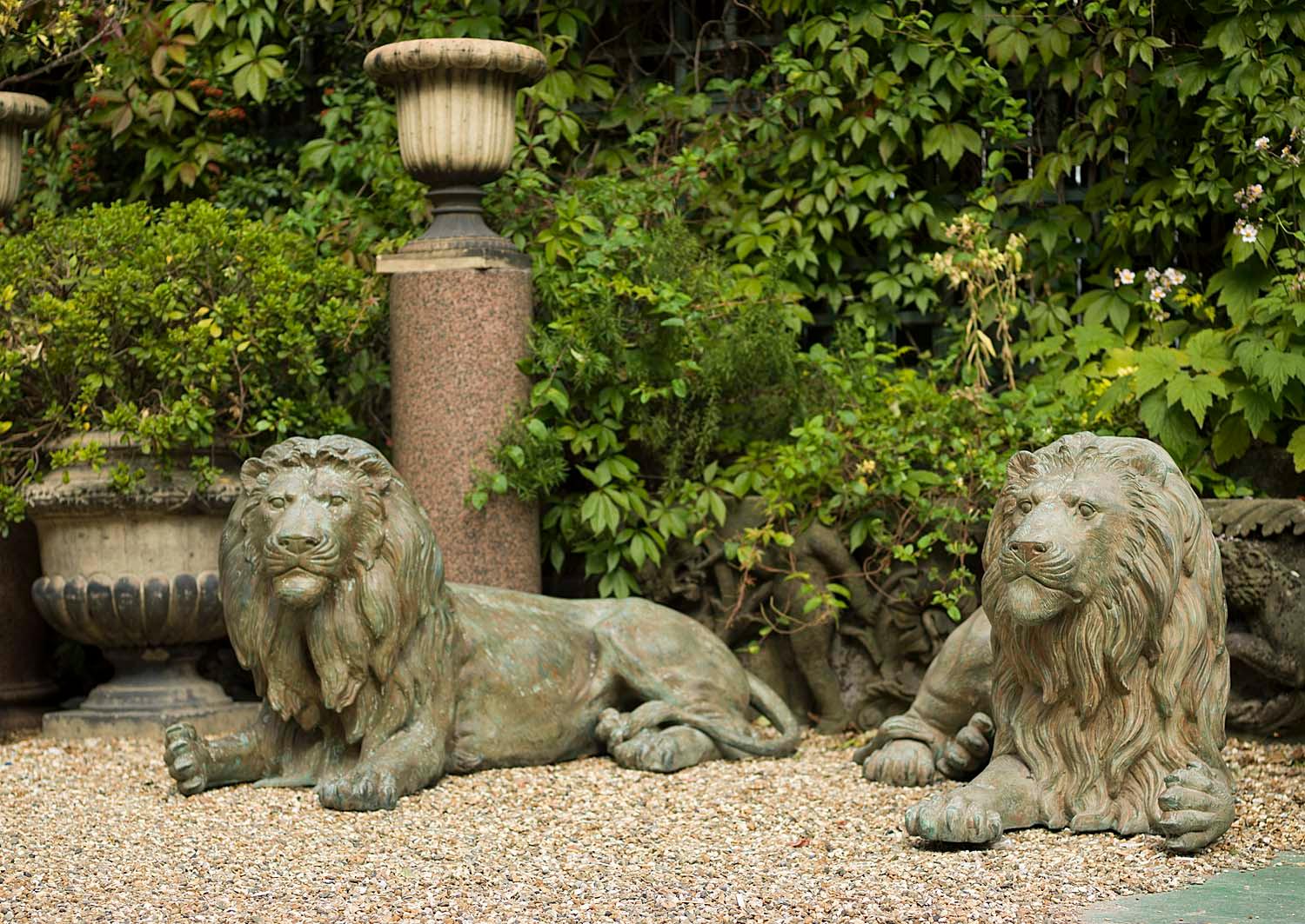 A pair of large and regal 20th century patinated bronze lions couchant. They could be displayed indoors, although their sheer size would dominate most rooms, rather much more suited to the outdoors in say a garden or a park.
Mid to late 20th