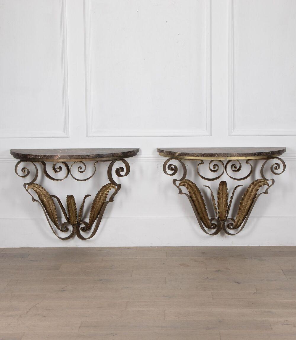 An extremely rare pair of 20th Century Italian gilt iron console tables.
Designed by the Italian architect Pier Luigi Colli.
These are wall mounted and have wonderful 30mm Emporado marble tops.
Circa 1970.