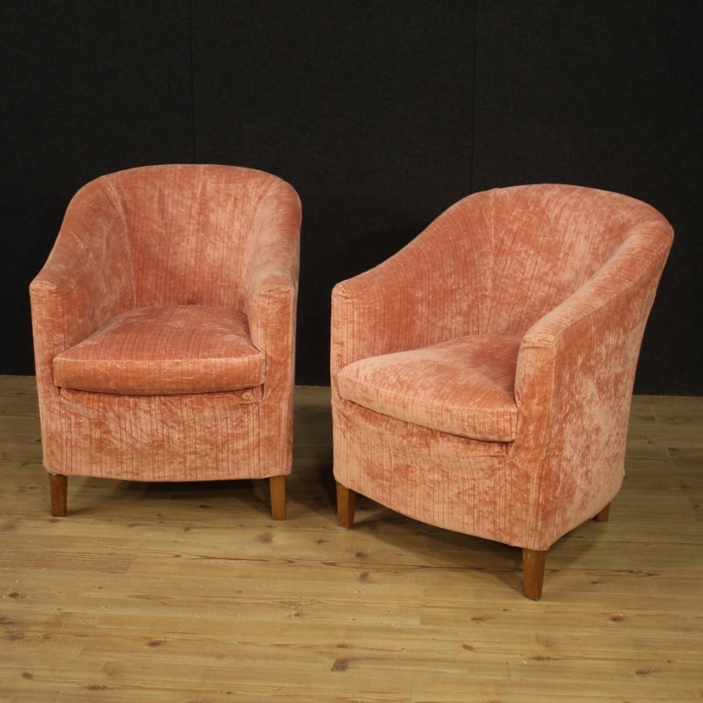 Pair of Italian design armchairs from the 1970s. Furniture of beautiful lines and pleasant decor covered in pink velvet. Wooden feet carved in beechwood of good solidity. Fabric that shows small signs of wear. Production chairs from Turin (Rostagno