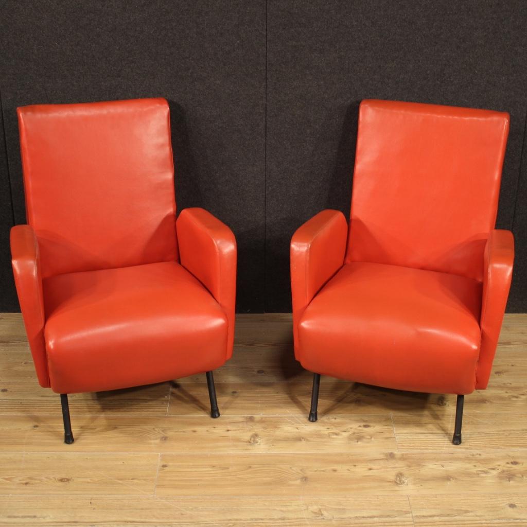 Pair of Italian design armchairs from the 1970s. Beautifully designed furniture of pleasant decor covered in faux leather with metal feet. Armchairs for living room or studio, for interior designers and amateurs of Italian design furniture. The faux