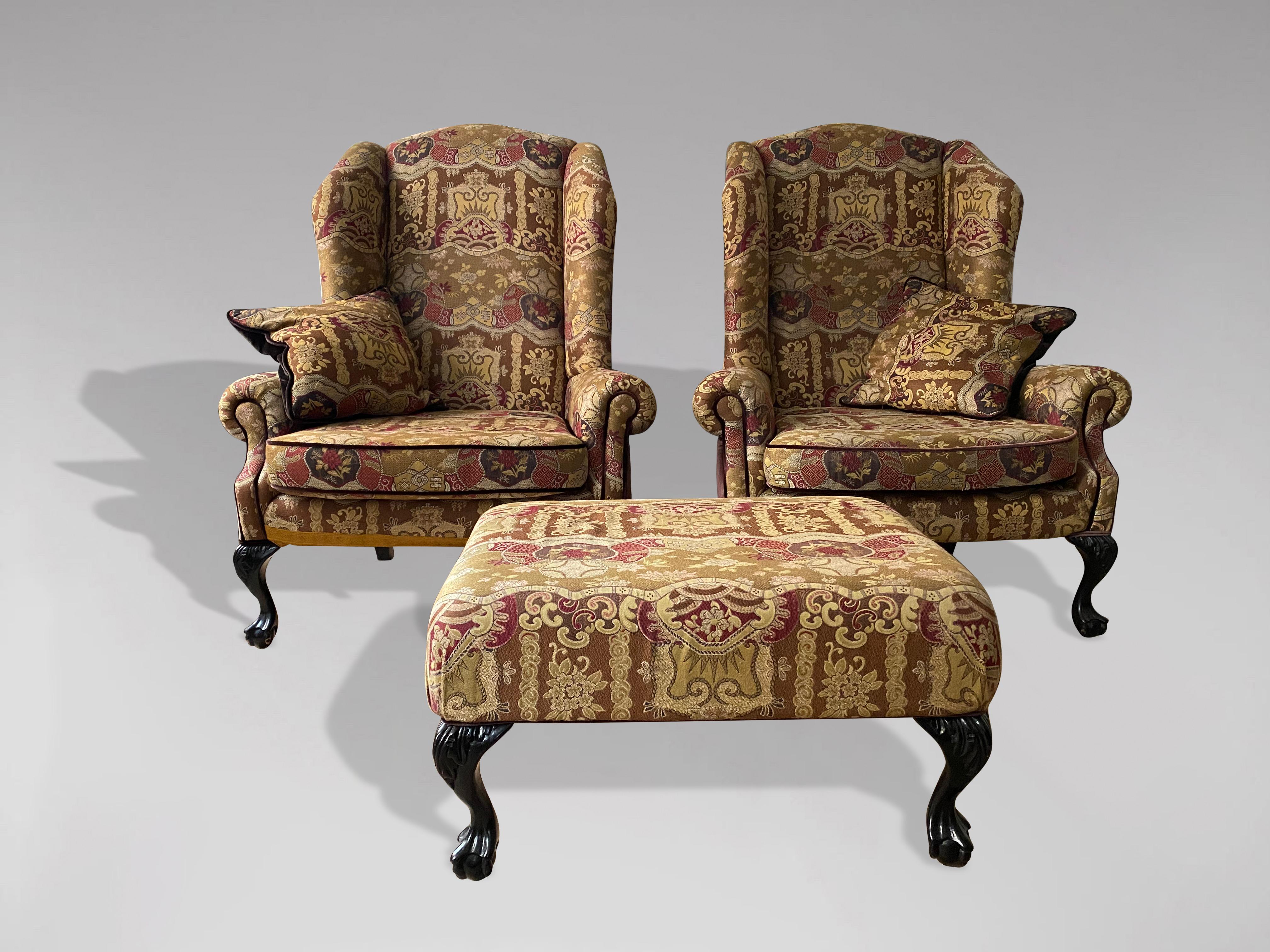 A pair of 20th century newly reupholstered wing armchairs with loose cushions, standing on painted mahogany carved cabriole legs ending on claw and ball feet. All recently fully reupholstered in a quality fabric. Very comfortable. Great quality wing