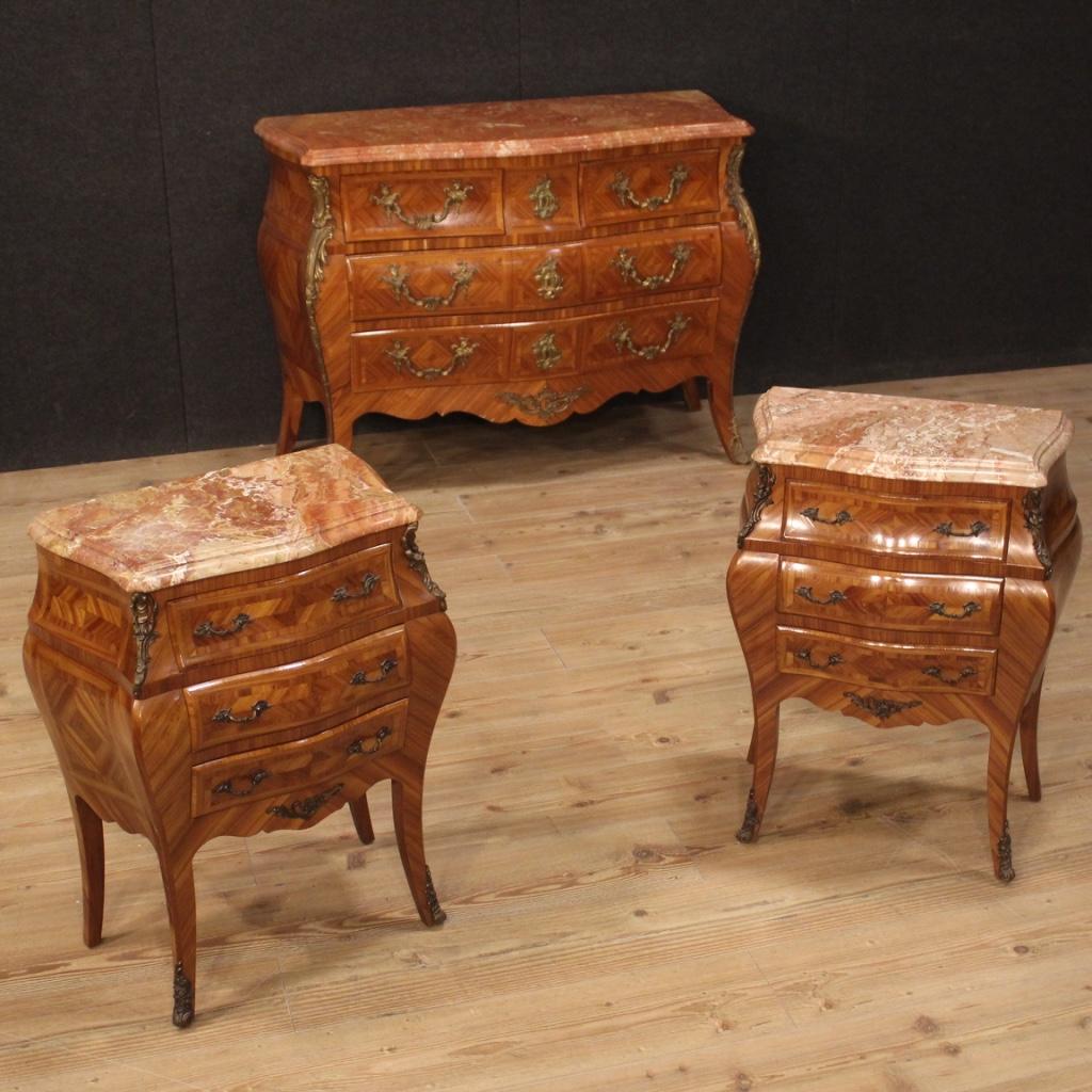 Pair of French nightstands from the mid-20th century. Louis XV style furniture in rosewood richly adorned with friezes and handles in gilded and chiseled bronze. Nightstands equipped with three drawers, of good capacity. Top in marble of good size