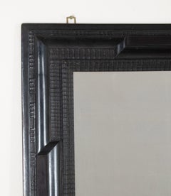 Pair of 20th Century Spanish Ebonised Ripple Moulded Mirrors