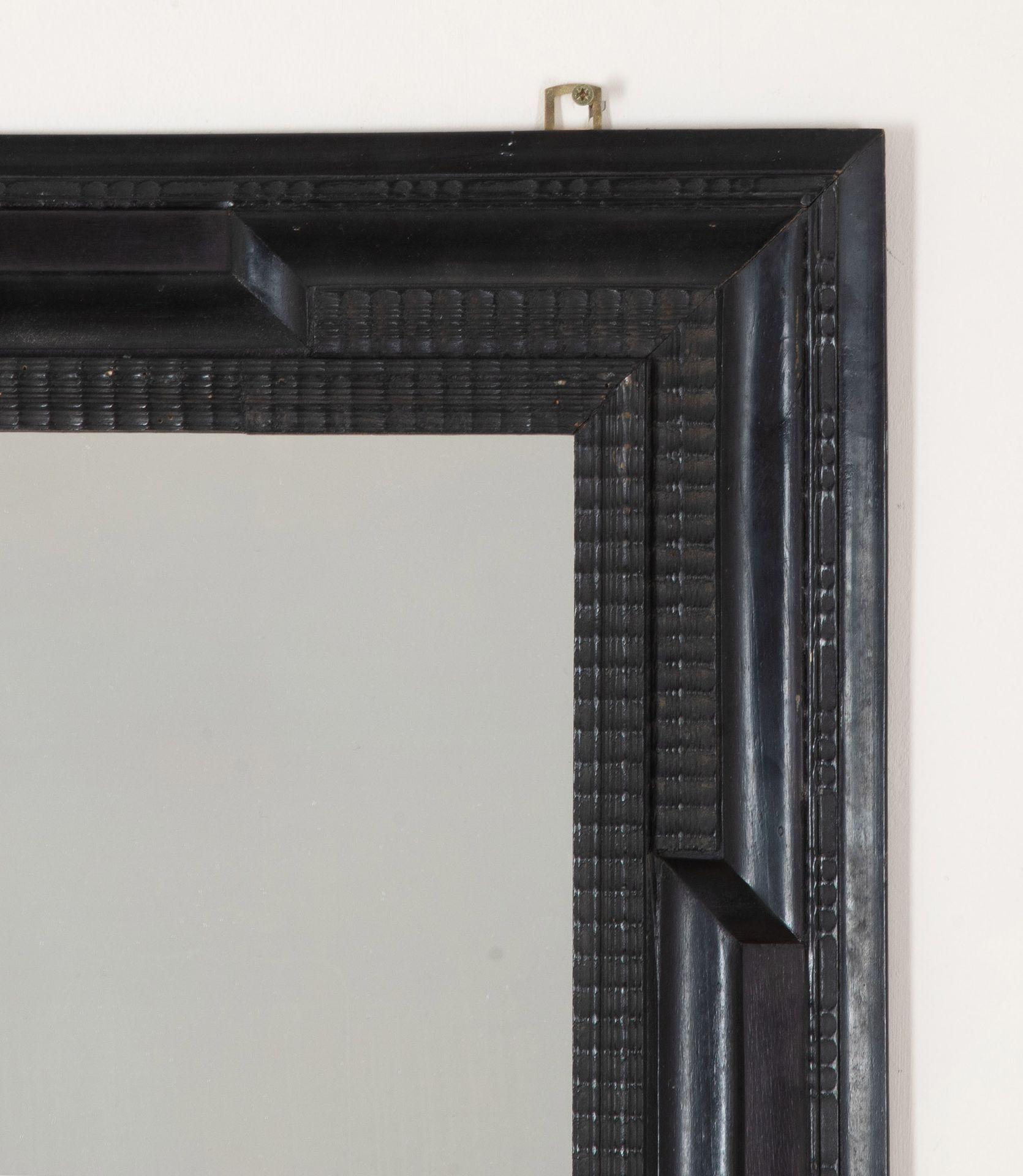 Pair of 20th Century Spanish Ebonised Ripple Moulded Mirrors For Sale 2