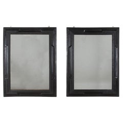 Pair of 20th Century Spanish Ebonised Ripple Moulded Mirrors