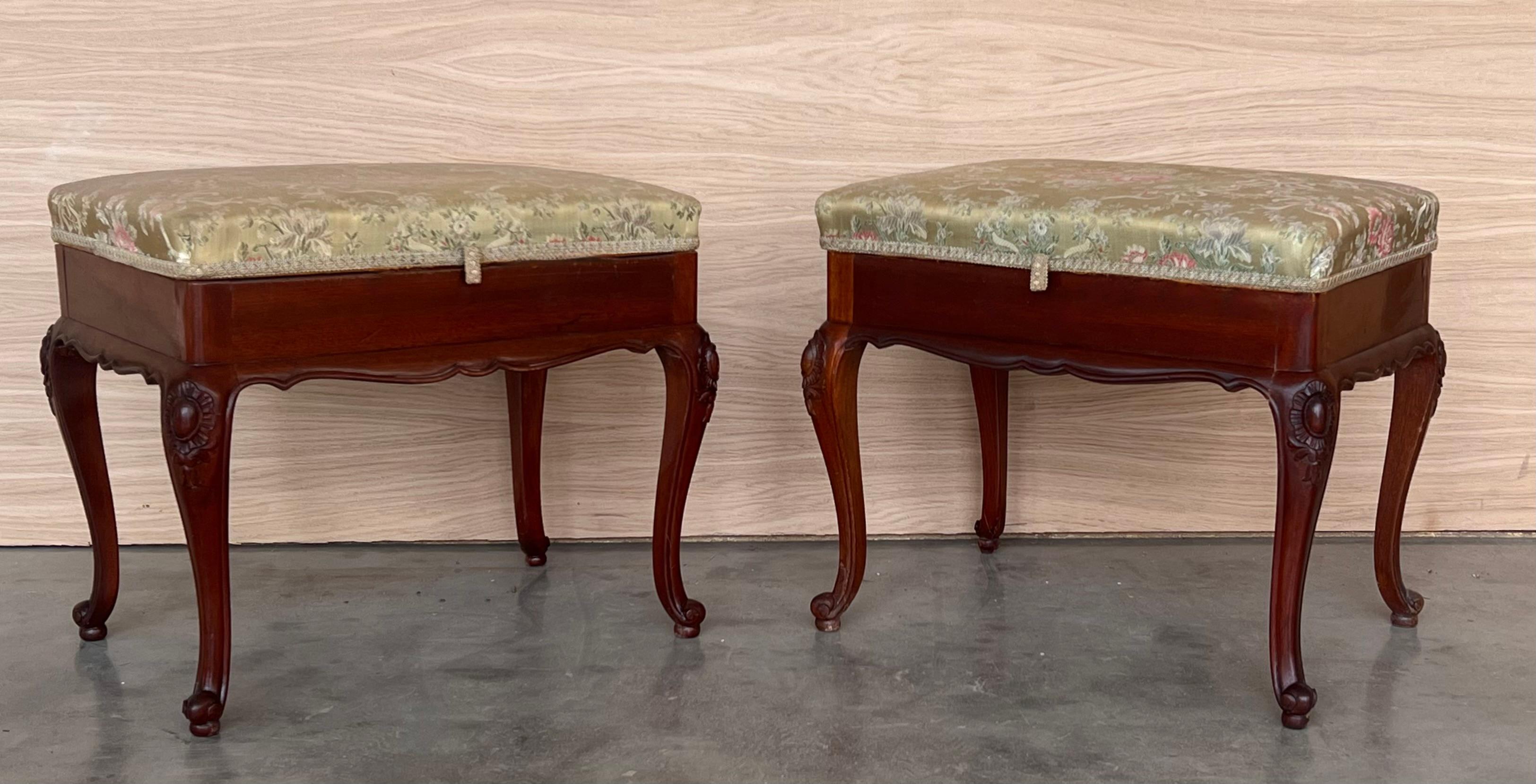 Pair of 20th century Spanish walnut Footstools standing on cabriole legs with richly foliate carvings and folding seat very useful to keep your clothes.