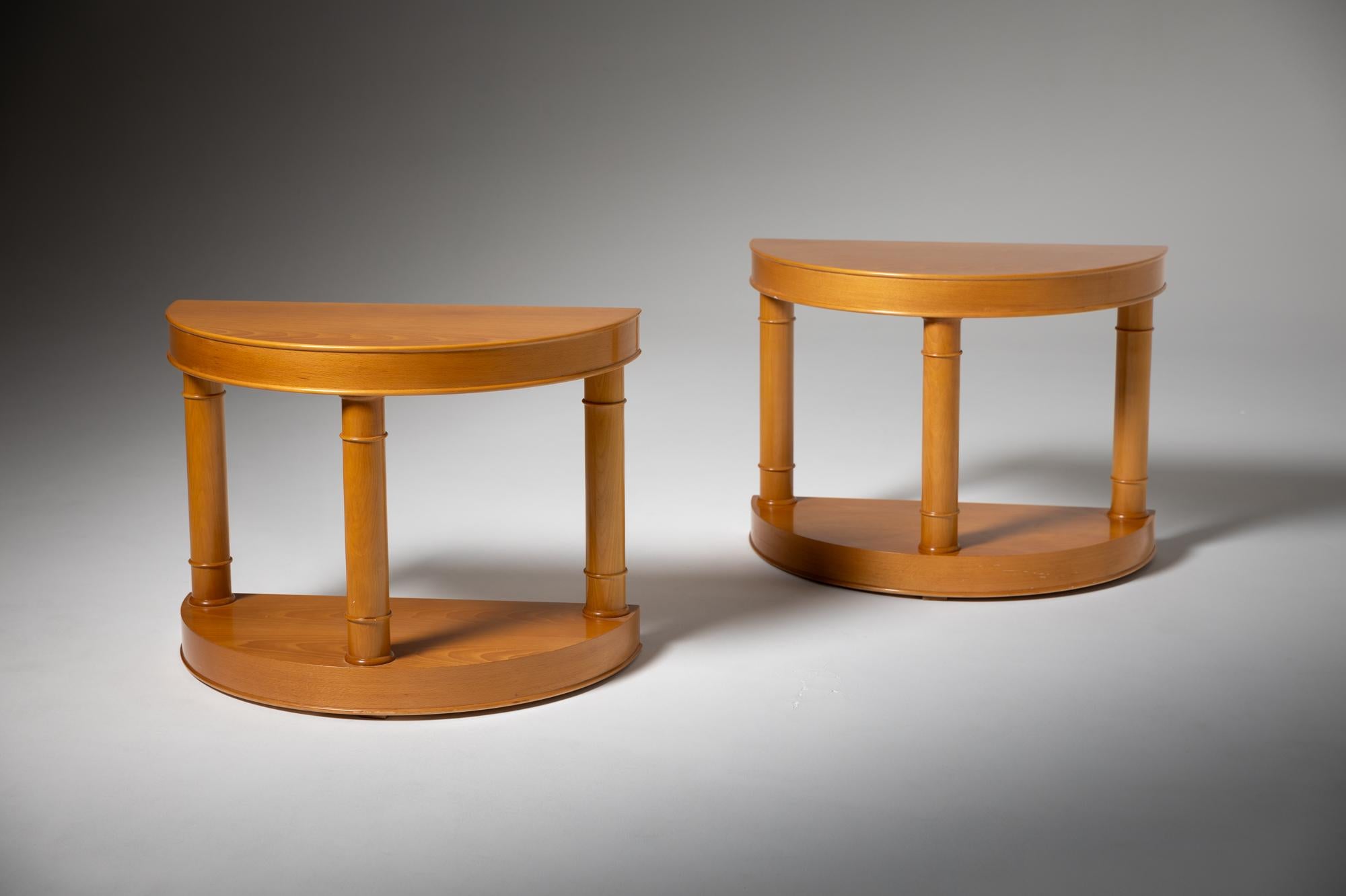 This pair of half-moon tables, crafted in Spain during the 20th century, beautifully showcases the elegance of solid beech wood combined with a fine veneer finish. The half-moon design is both aesthetically pleasing and practical, allowing the