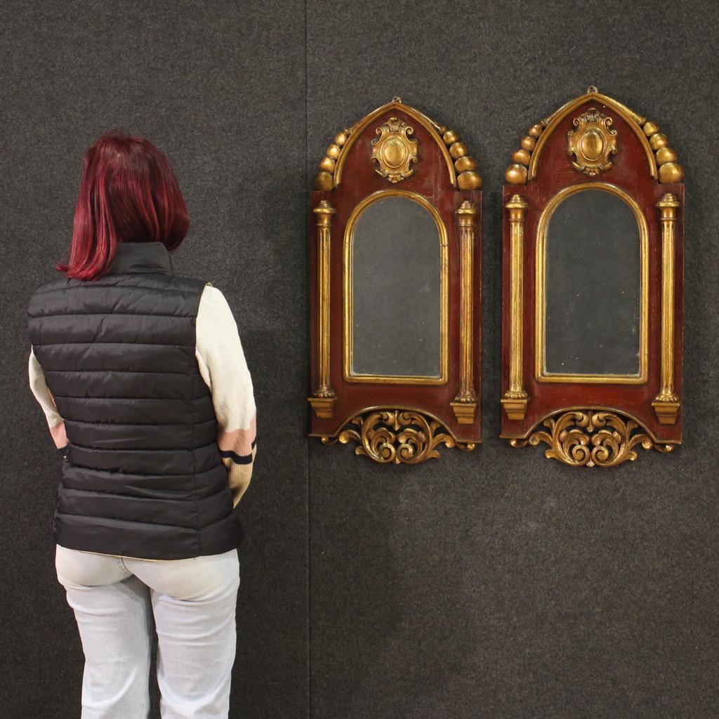 Pair of Spanish mirrors from the mid-20th century. Finely carved, lacquered and gilded Neo-Gothic style furniture. Beautifully sized and proportioned mirrors that can easily be placed in different parts of the house. Original mirrors that reflect