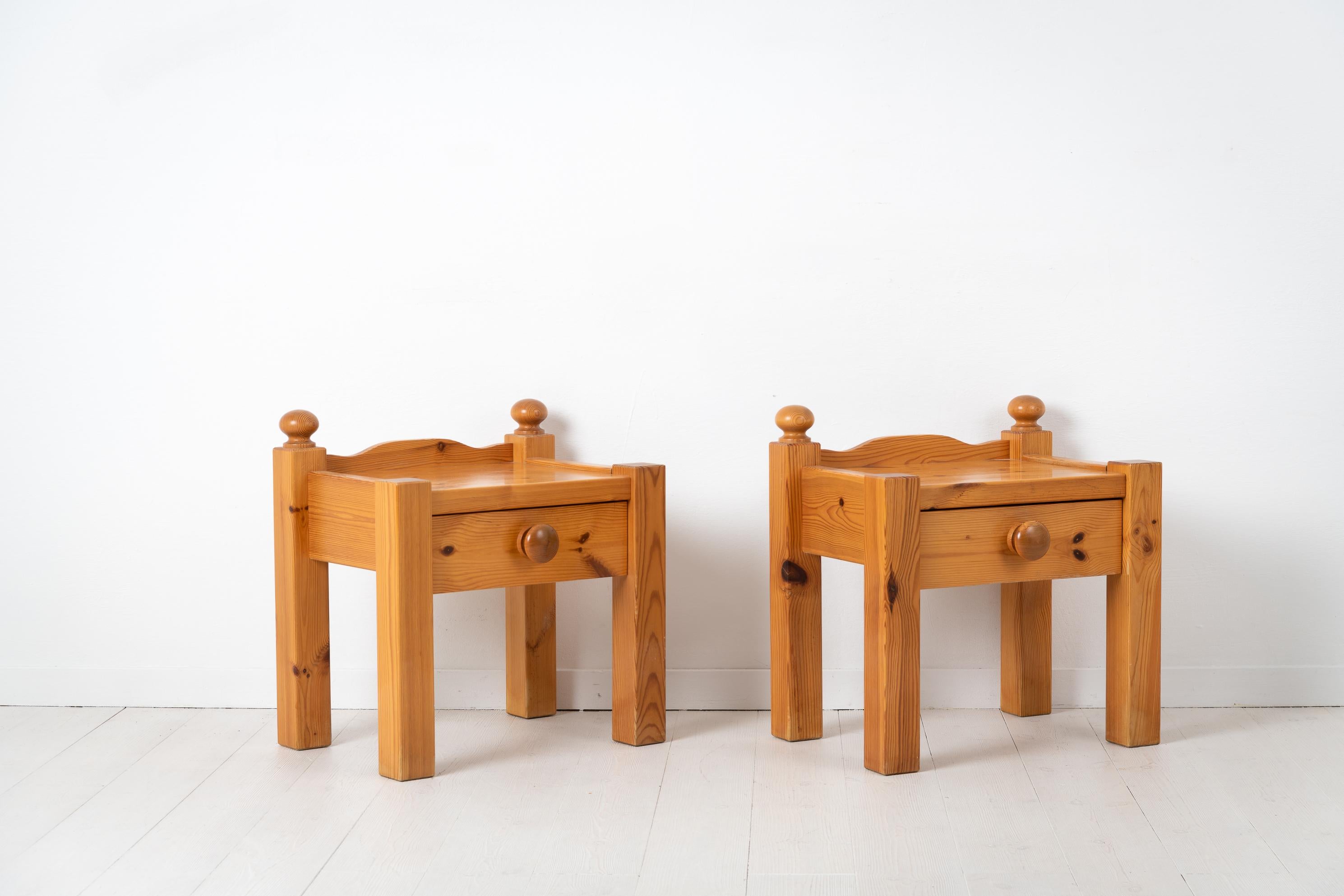 Pair of nightstands from Sweden made during the 1970s. The nightstands are lacquered solid pine with a large single drawer. Height to the table top is 45 cm and height to the back rim is 48.5 cm. The nightstands are in good vintage condition