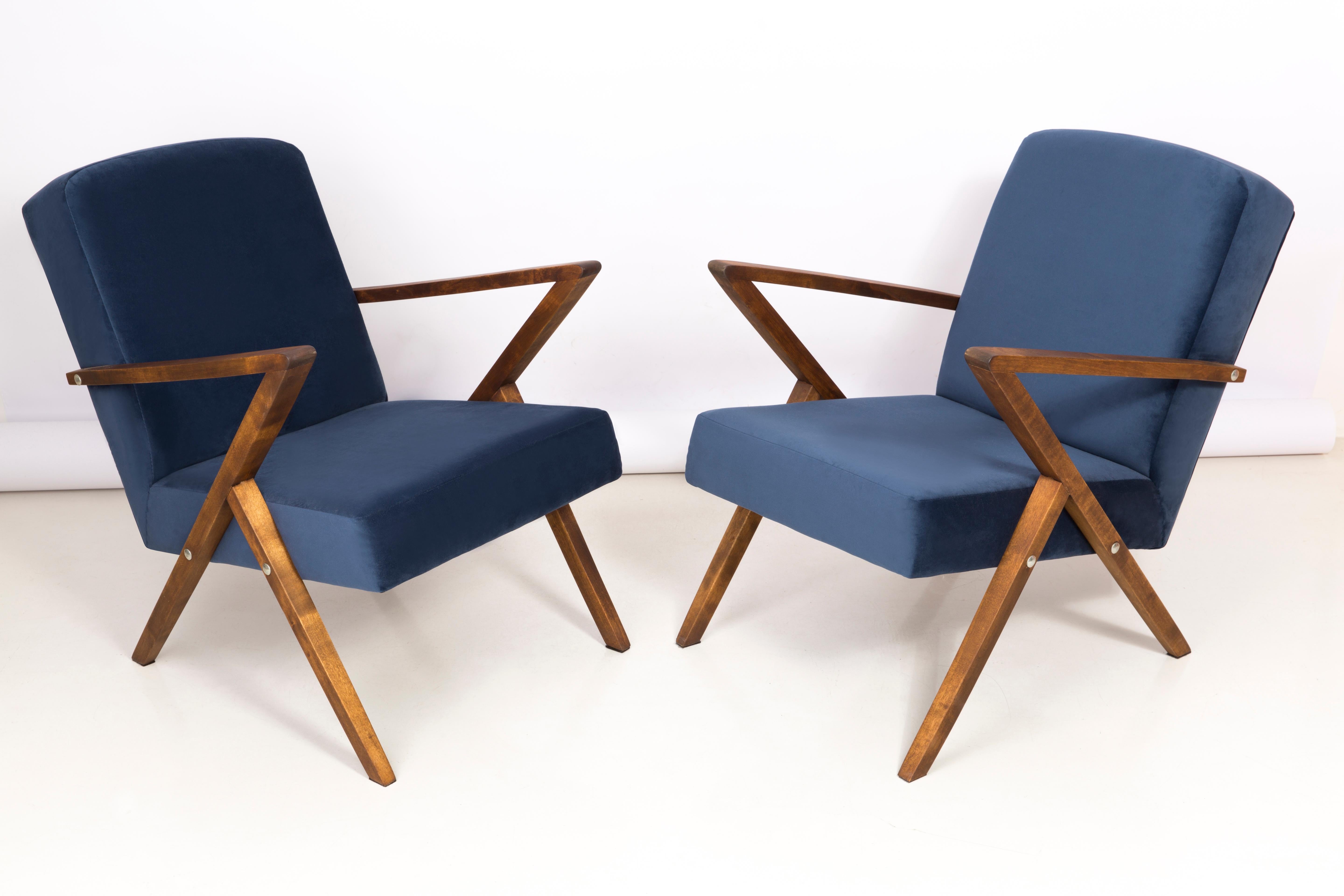 A pair of armchairs manufactured at the Bydgoszcz Renewal Cooperative in the 1970s. The armchairs are after a comprehensive renovation of carpentry and upholstery. The wood has been cleaned, cavities completed, painted with dark walnut stain,