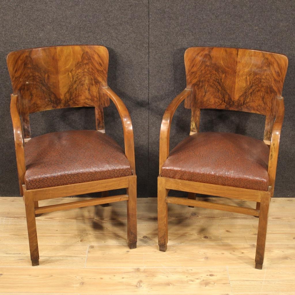 Pair of Italian armchairs from the mid-20th century. Furniture carved and veneered in walnut and burl walnut of particular line and construction. Armchairs complete with (separable) seats with discreetly comfortable spring padding. Height at the