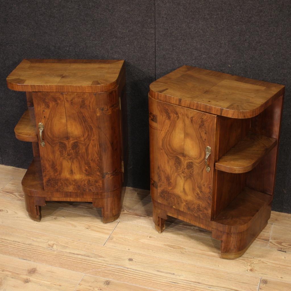 Pair of Italian bedside tables from the first half of the 20th century. Art Deco style carved and veneered furniture in walnut and burl. Bedside tables equipped with one door and two fixed side shelves of good capacity, wooden top of good size and