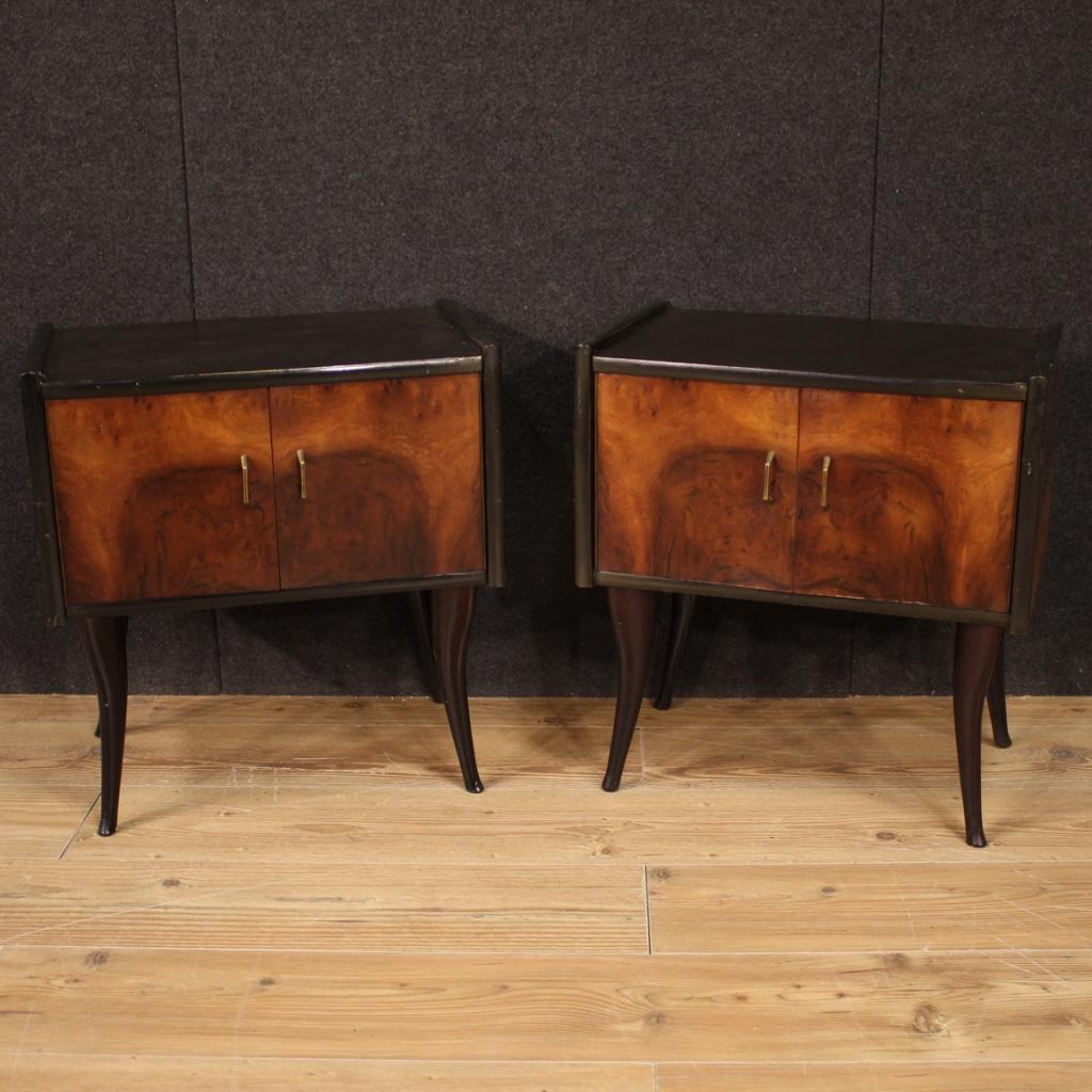 Pair of Italian design bedside tables from the 1960s-1970s. Walnut and ebonized wood furniture of beautiful lines and pleasant decor. Night stands with two doors and wooden top of fair size and service. Ideal furniture to be placed in a bedroom or