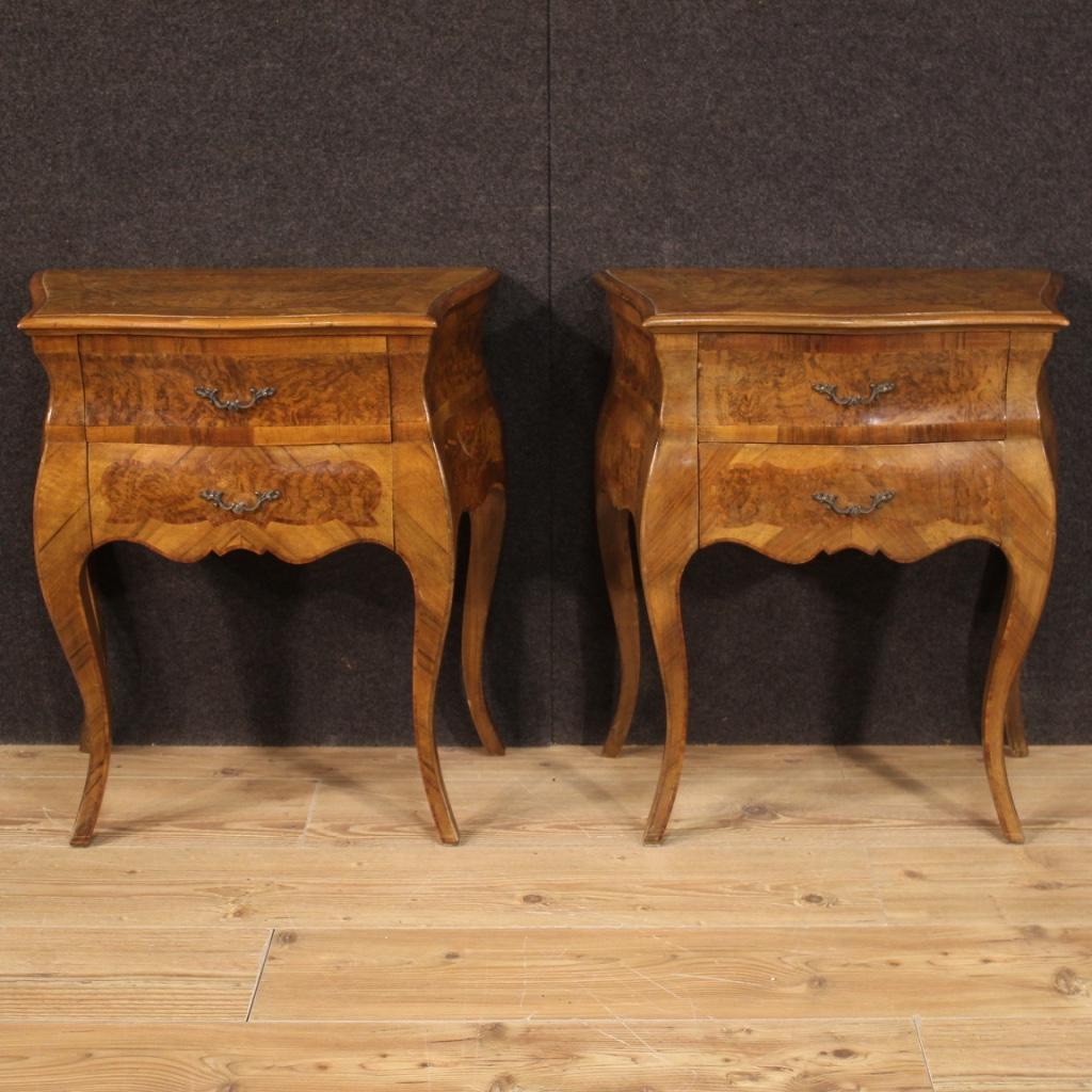 Pair of Italian bedside tables from the 20th century. Inlaid furniture in walnut, burl, rosewood and beech of beautiful lines and pleasant decor. Wavy and rounded bedside tables equipped with two drawers each and wooden top in character (see photo)