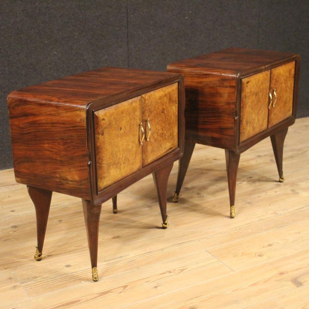 Pair of Italian design nightstands from the 1960s. Furniture carved in walnut, palisander, beech and burl wood with decorations in gilded and chiseled bronze and brass. Ideal bedside tables to be placed in a bedroom or living room, pleasantly