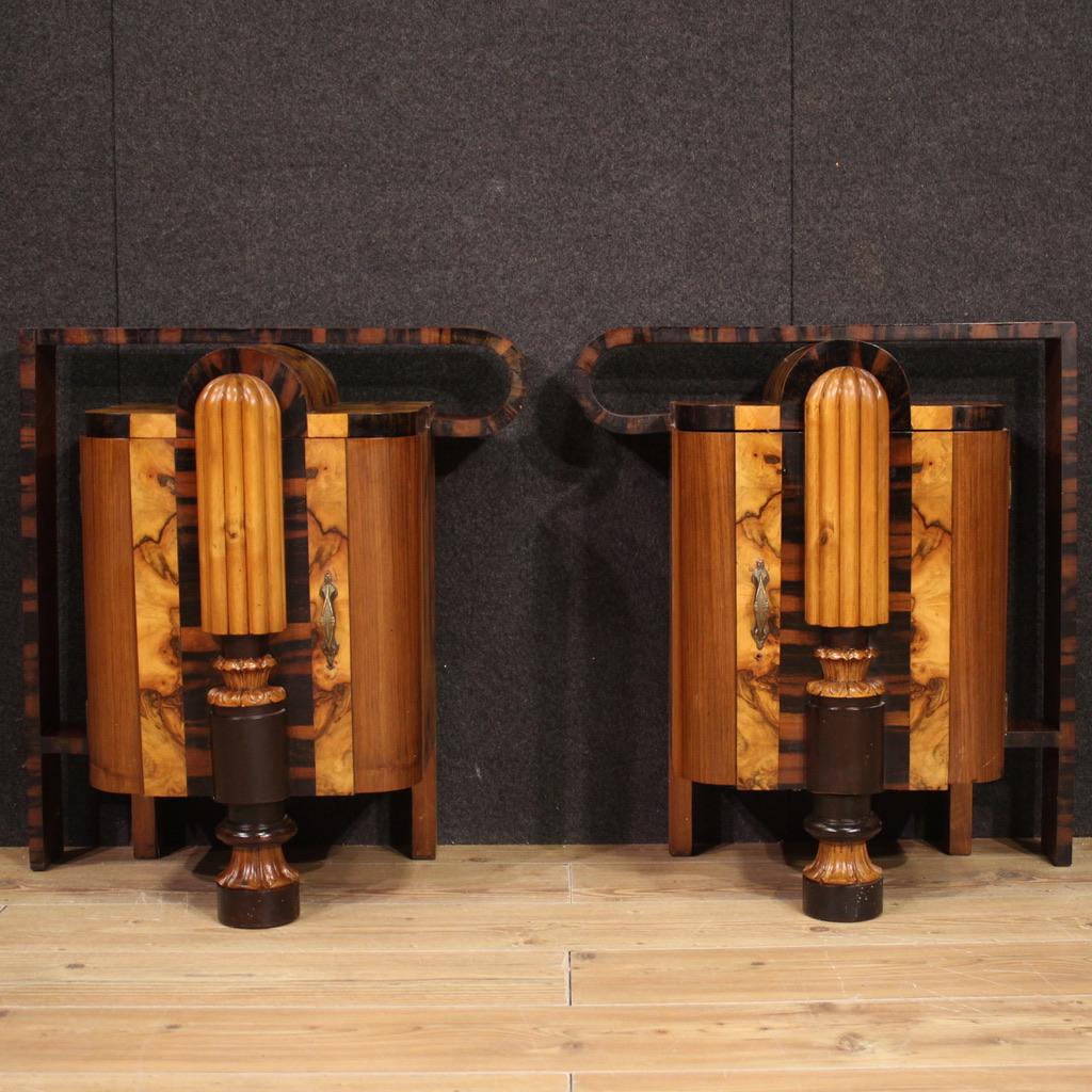 Exceptional pair of Italian Art Deco bedside tables (1930). Fabulously carved and veneered furniture in walnut, African walnut, burl and fruitwood. Bedside tables with a door that offers a flatter support surface inside at the base (see photo). The
