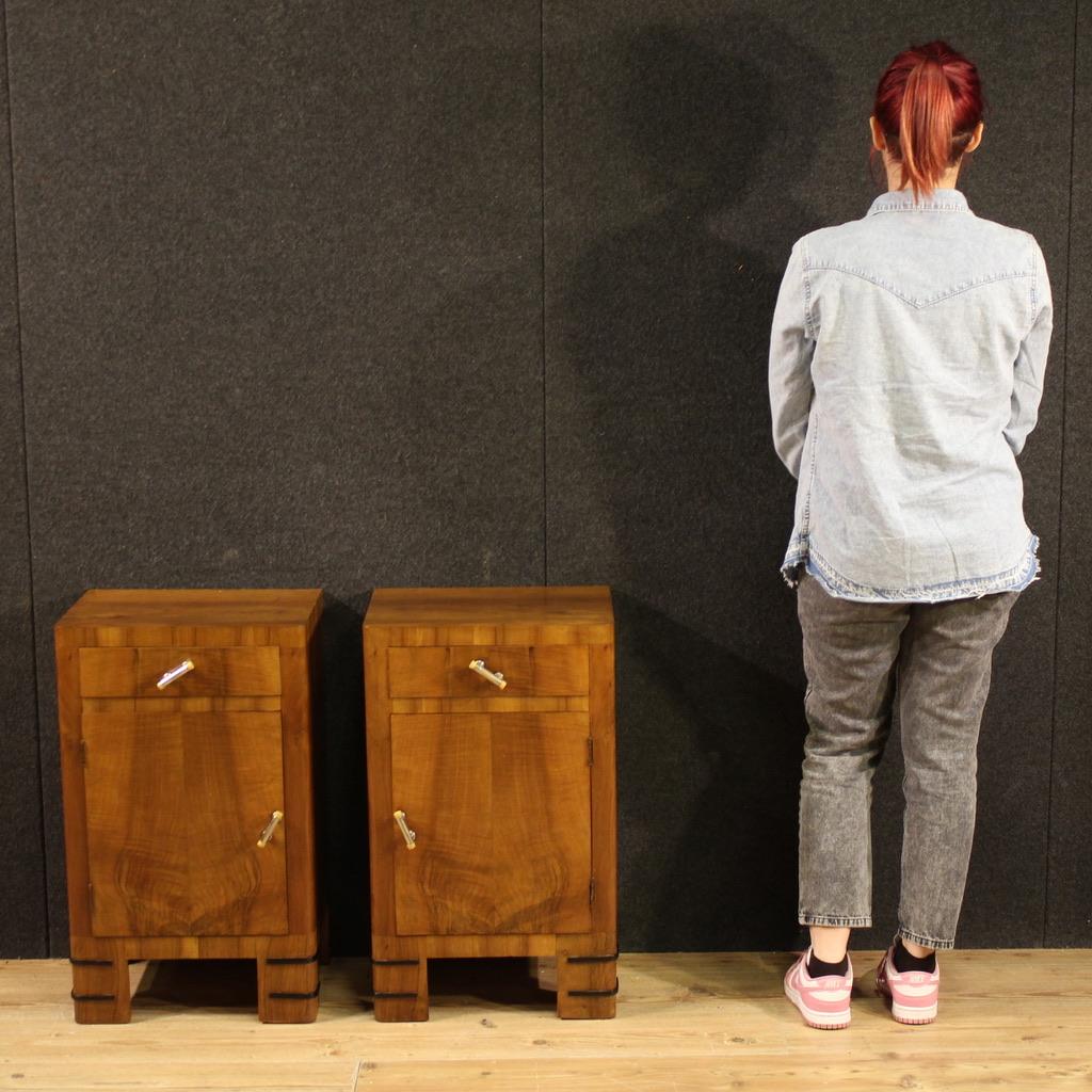 Pair of mid-20th century Italian bedside tables. Beautifully lined and pleasantly furnished Art Deco furniture, veneered in walnut and fruitwood with ebonized wood decorations. Bedside tables of excellent proportions equipped with a drawer and a