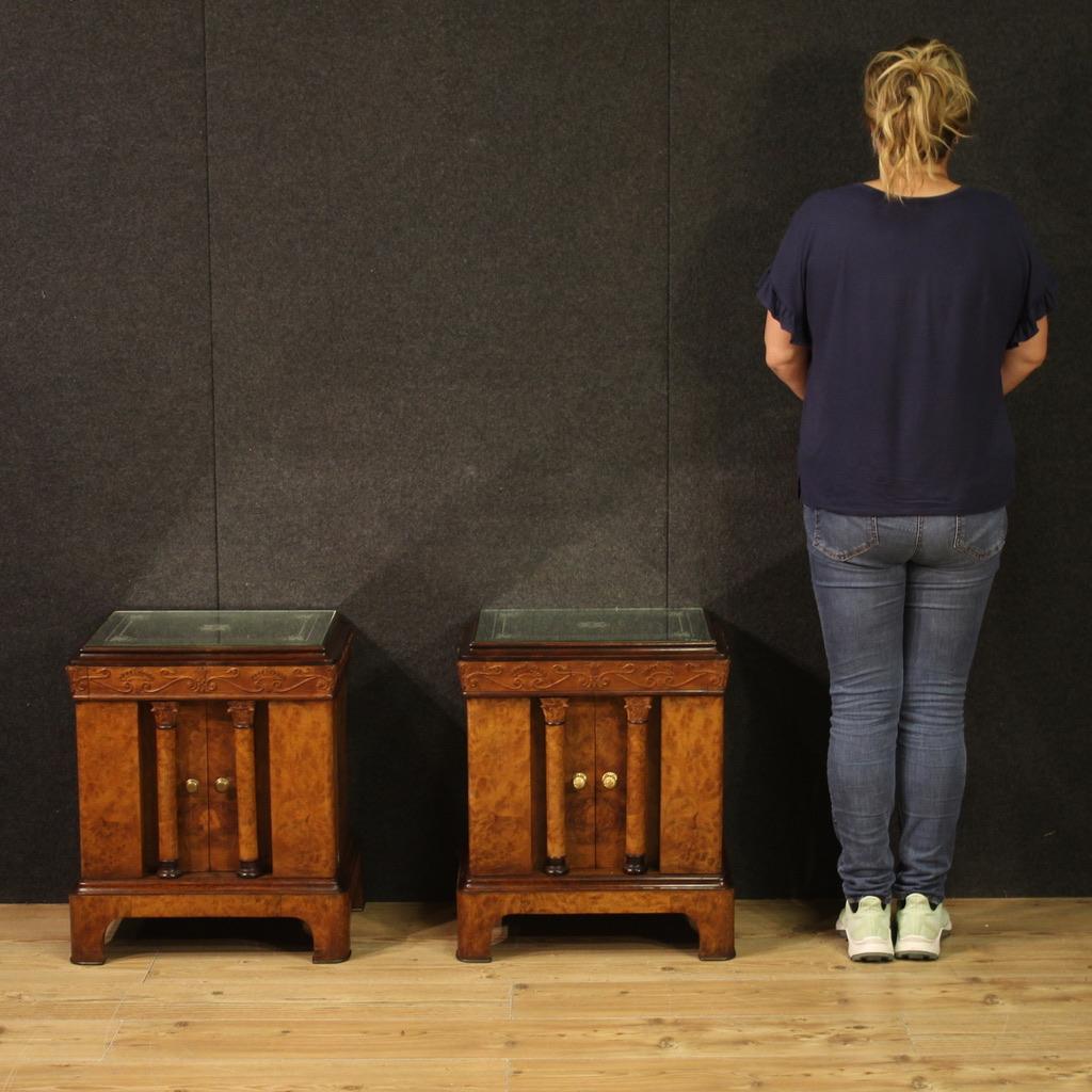 Pair of Italian bedside tables from the mid-20th century. Cantù-made furniture in Empire style veneered in burl, mahogany and beech. Bedside tables with two doors and a drawer of good capacity, ideal for a bedroom or living room. Top in antiqued
