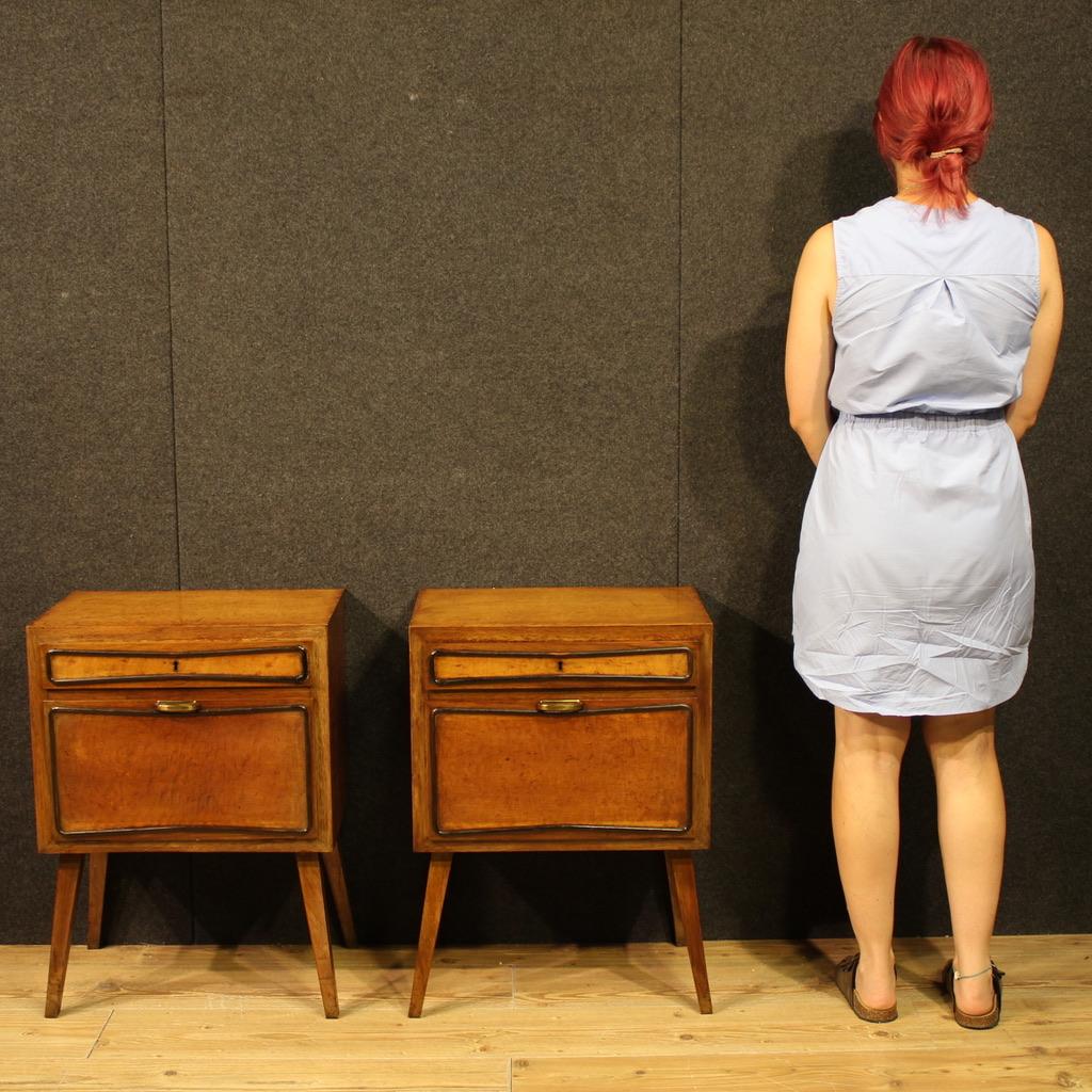 Pair of Italian design nightstands from the 1970s. Fabulous furniture, veneered in thuja burl with embossed ebonized wood trim. They feature a drawer and a generously sized compartment with a sliding door. The wooden top is of excellent size and is