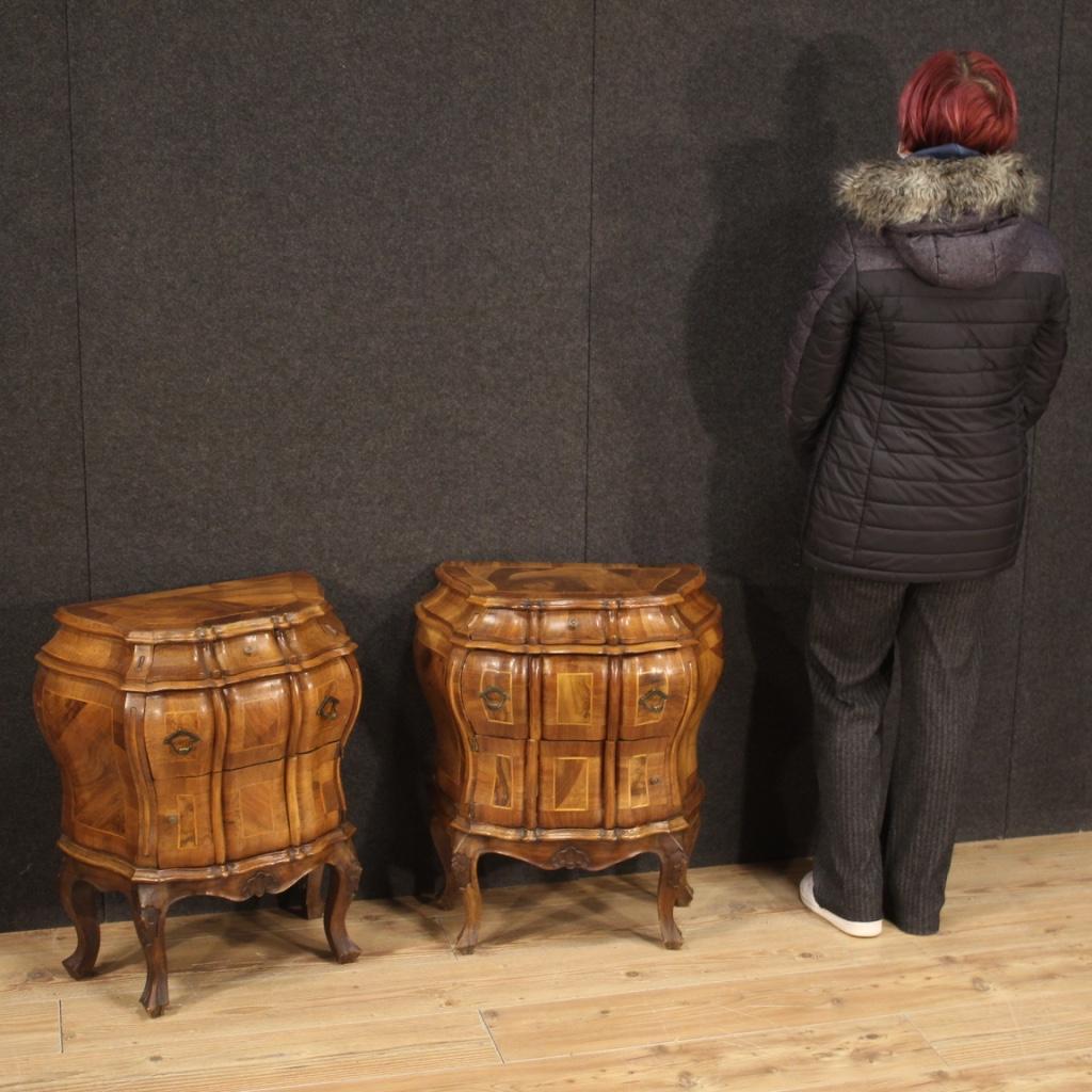 Pair of Venetian bedside tables from the 20th century. Wavy and rounded furniture in walnut, maple, beech and fruitwood. Beautifully sized bedside tables of pleasant decor equipped with two drawers in the upper part and a door in the lower part (see