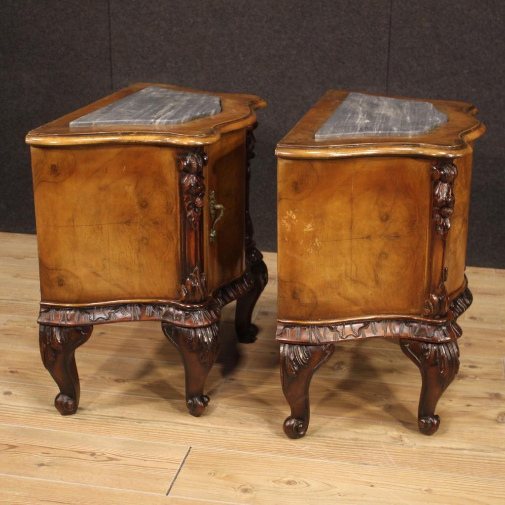 Pair of Italian bedside tables from the mid-20th century. Wavy and rounded furniture in walnut and beech woods of beautiful lines and pleasant decor. Bedside tables with one door of good capacity with recessed gray marble top of discreet size and