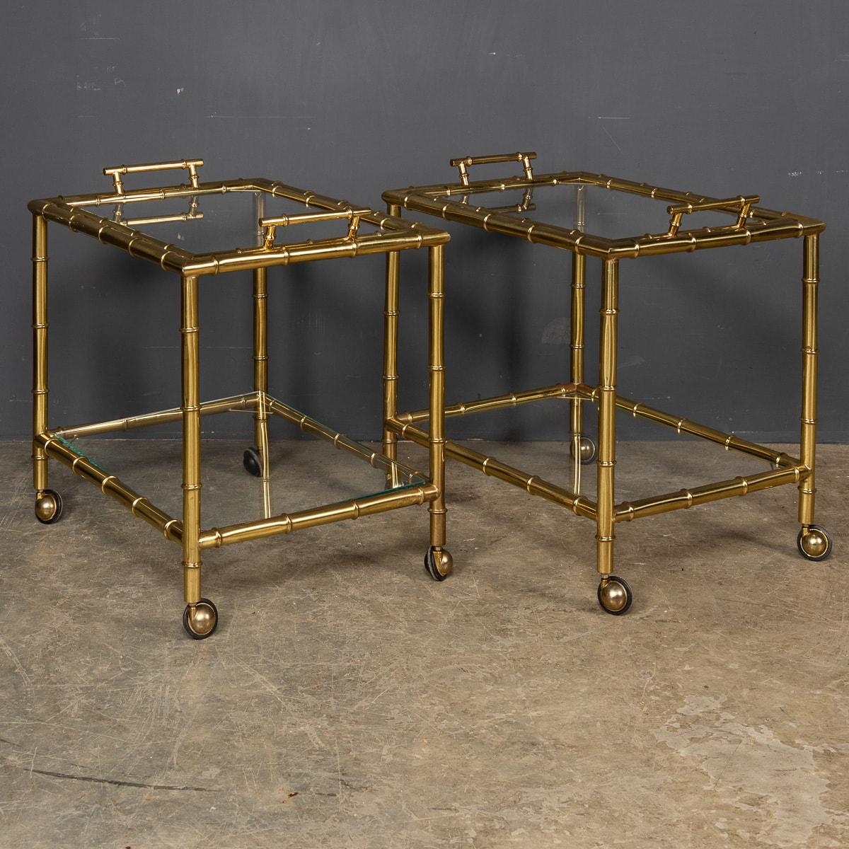 Stylish mid 20th century French brass faux bamboo two-tier trolleys, this fine pair of trolleys have their original castors and removable trays with twin handles, made possibly Maison Jansen. A must have for any sophisticated cocktail or dinner