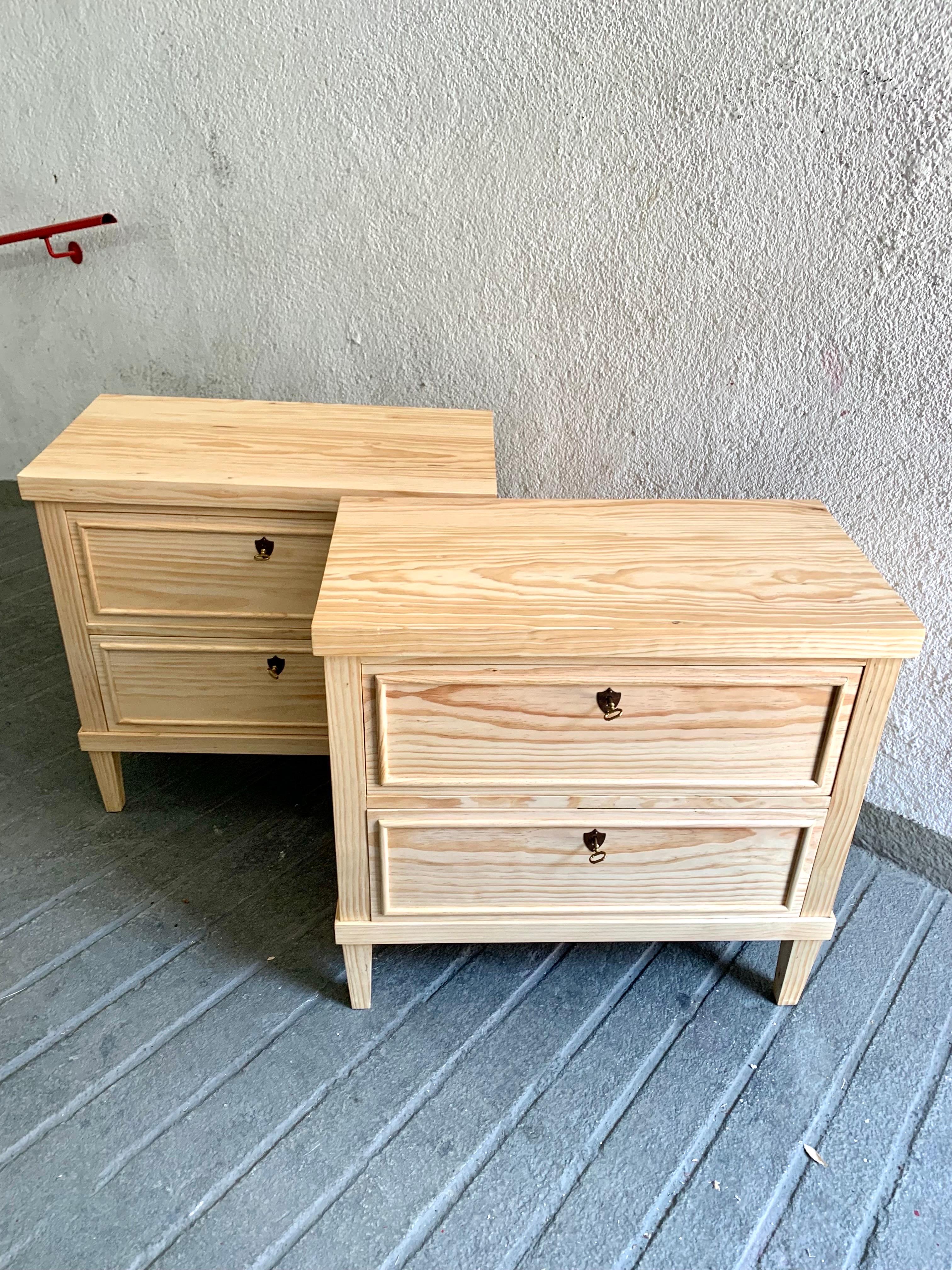 Pair of chests of drawers or nightstands, of current artisan manufacturing of cabinetry, based on the Biedermaier style, is an interpretation of a more rustic style, in solid pine wood, hence its weight, made with two drawers with golden brass