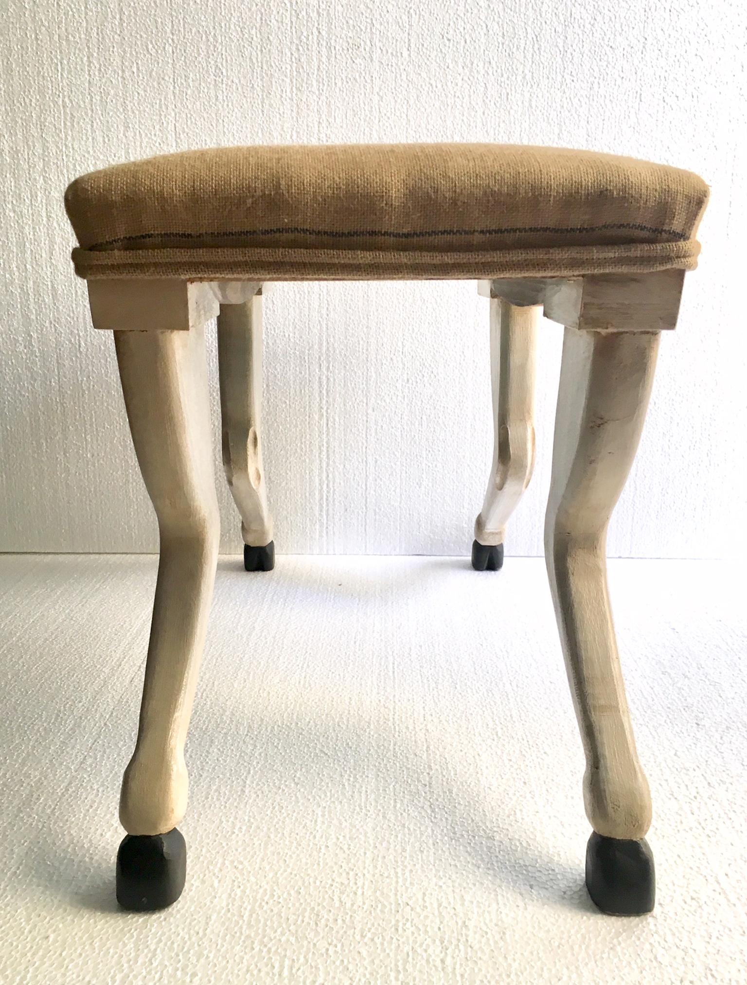 Pair of benches, carved in beech wood, and hand painted, finished in the form of horse legs.