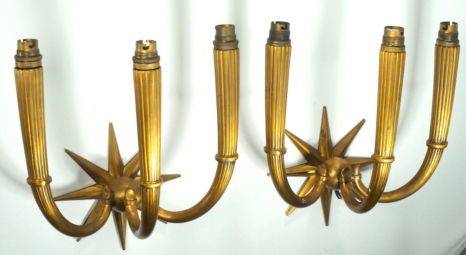 French Art Deco, circa 1937 pair of 3-branch sconces in gilt bronze, attributed to Andre Arbus.