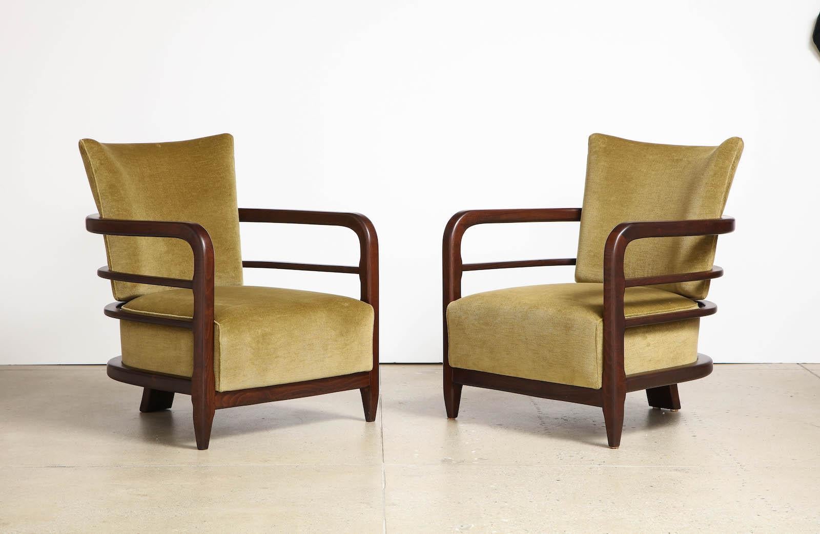 Dark-stained ash and cotton velvet upholstery. Streamlined 1930s forms with a stylized rear-center leg.