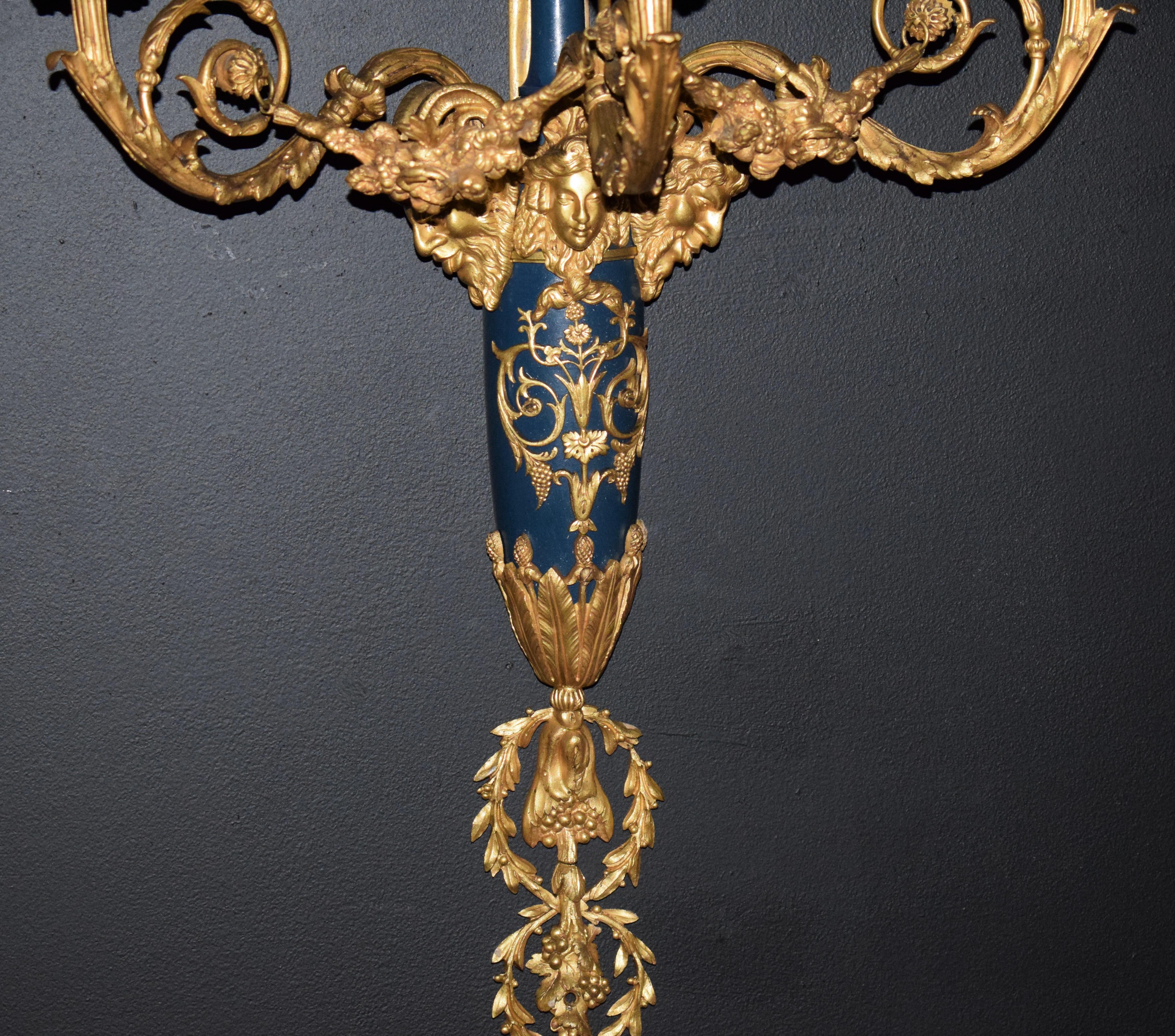 Louis XVI style wall sconces. A very fine pair of Louis XVI style partially enameled and gilt bronze three light wall sconces. France, circa 1900.

Dimensions: Depth 11 1/2 x Height 37 x width 18 inches.

CW4867.