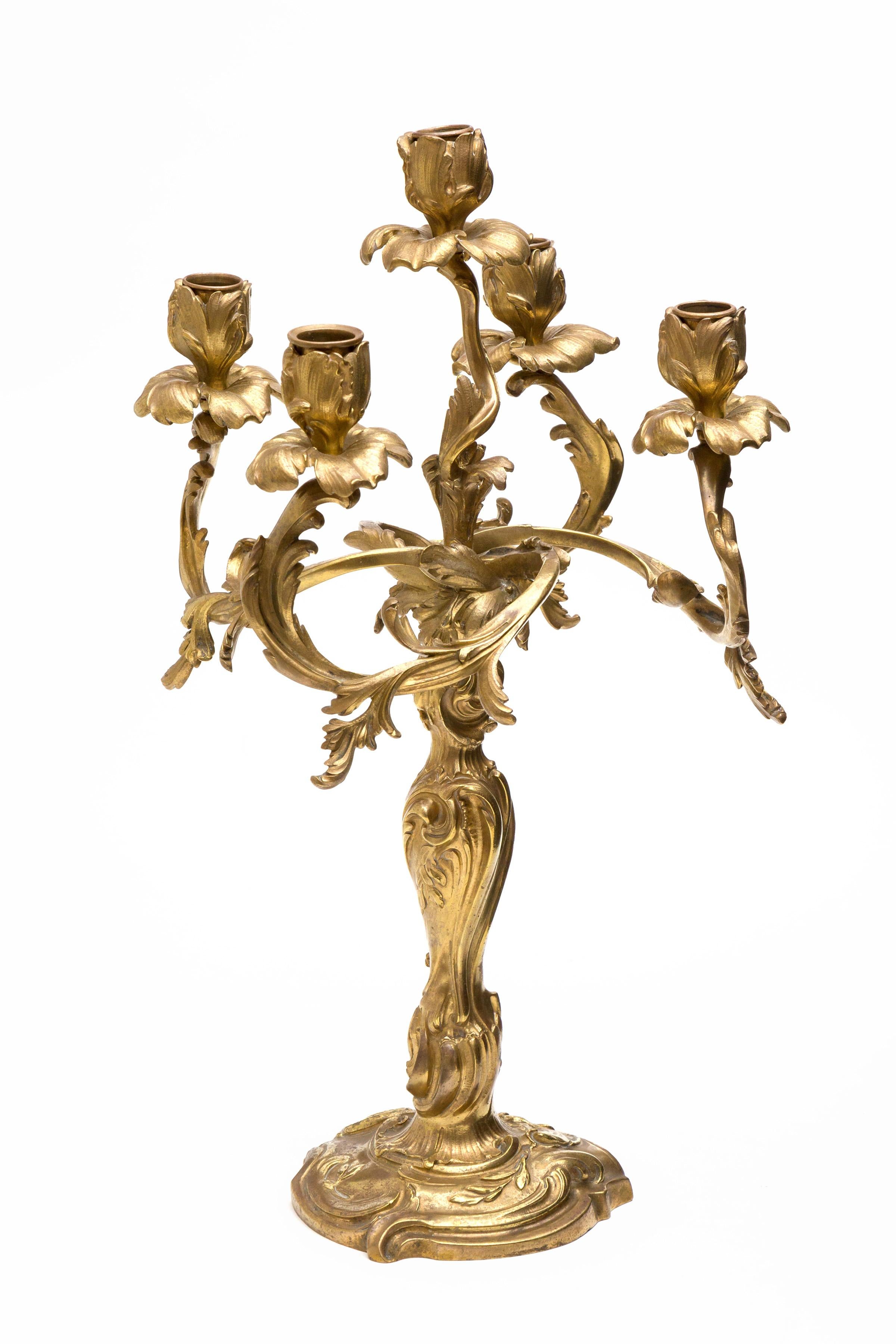 The four-light are each cast as open flower heads, over the spills in the form of leaves, supported on stylized Rococo branches.

Shipping included 
Original art work(s).



   