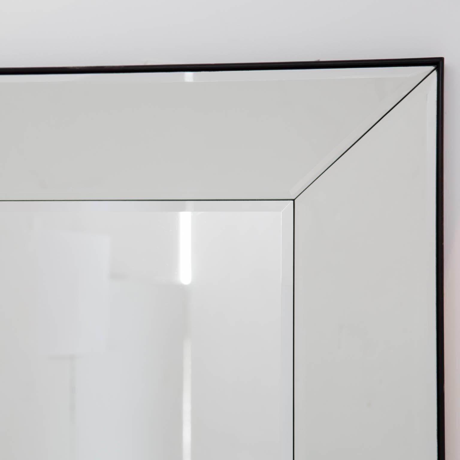 Discontinued pair of large Williams Sonoma beveled mirrors. Can be hung vertically or horizontally with included mounting brackets.