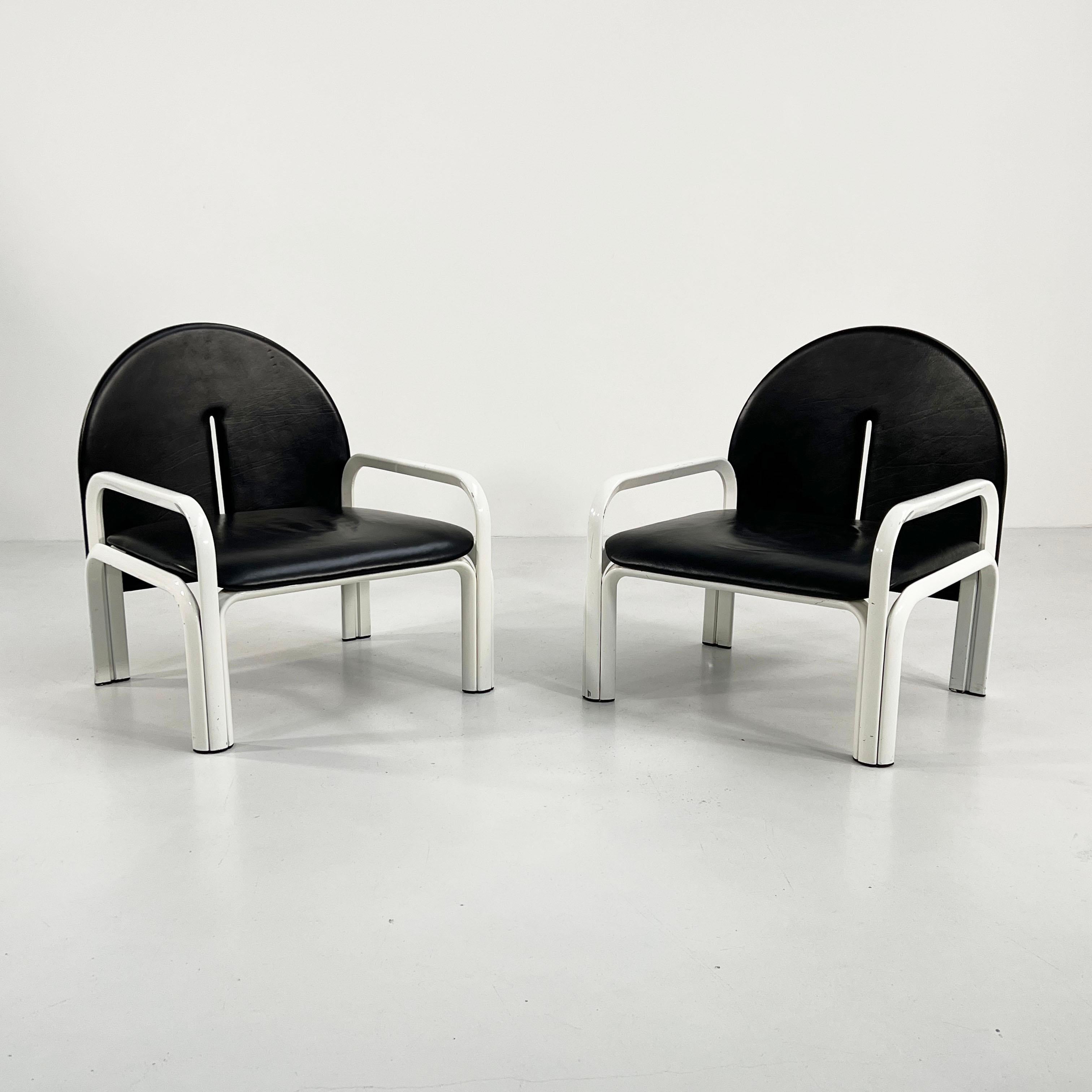 Designer - Gae Aulenti
Producer - Knoll
Model - 54 L Armchairs
Design Period - Seventies 
Measurements - Width 70 cm x Depth 61 cm x Height 77 cm x Seat Height 35 cm
Materials - Leather, Metal
Color - White, Black 
Comments - Light wear consistent