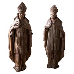 Pareja de obispos tallados del siglo XVI de 1,70 m de altura