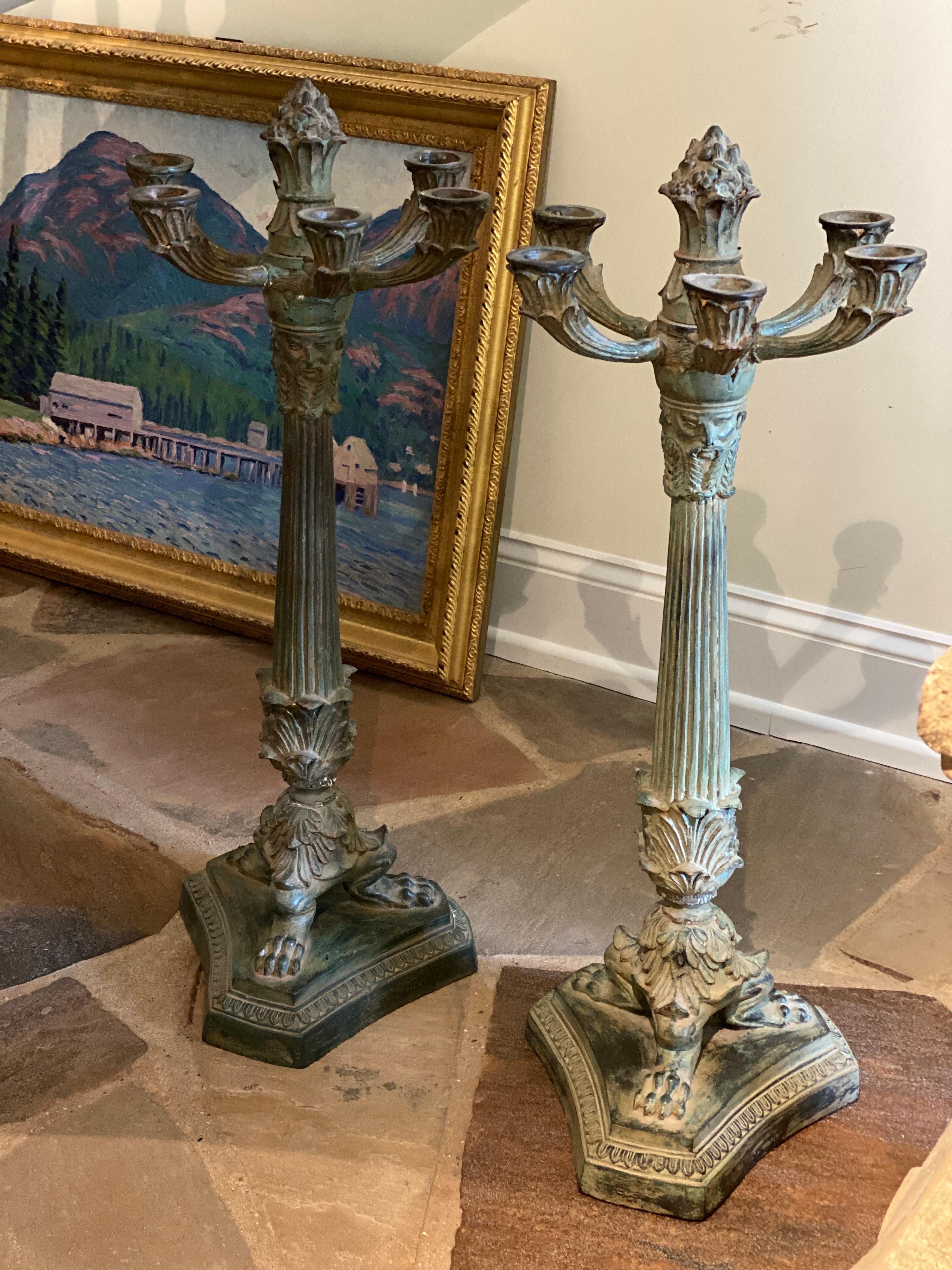 A Stunning pair of 6 Arm French Empire Neoclassical style iron verdigris table candelabras. Solid bronze or iron candelabras in a lovely green verdigris finish. 
Good overall condition, remnants of wax and overall wear. Please note the width of the