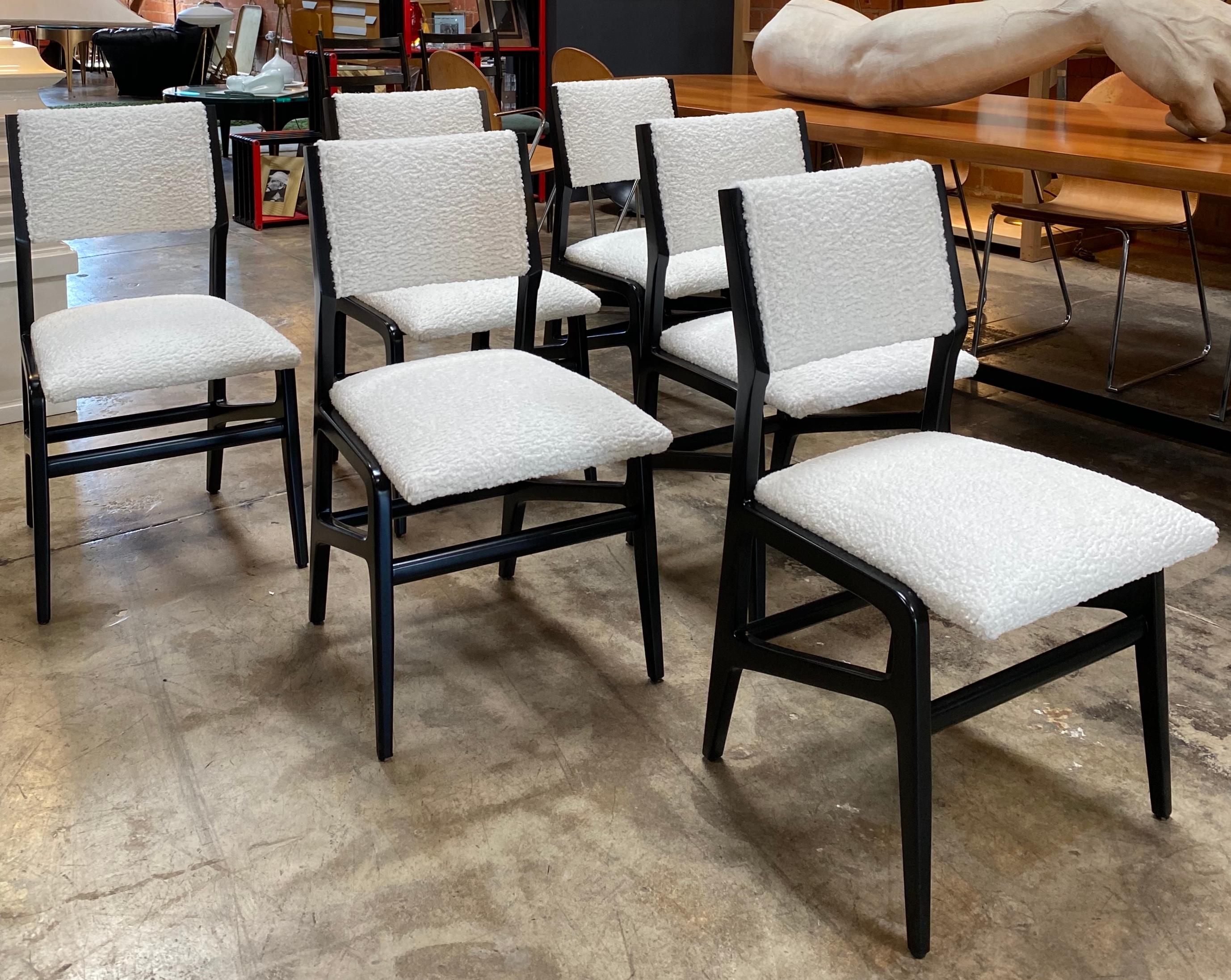 An elegant and timeless design.
Made of Italian black wood with sensuous lines and new chic white sheep wool textured upholstery.
The wood has been refinished without taking away from its' historical integrity.
These chairs, with their organic