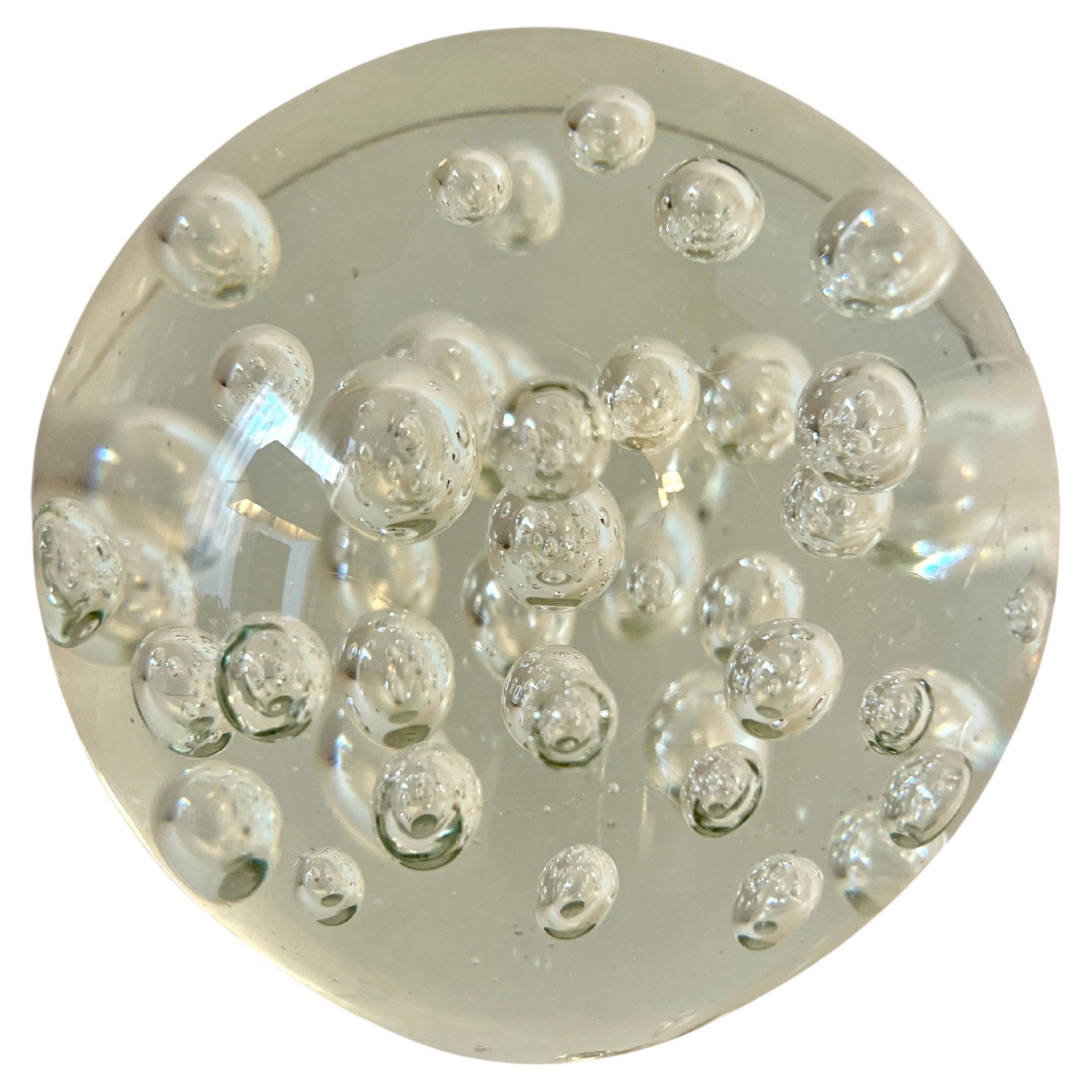 A Clear Glass Paperweight with bubbles.  Very large sphere that measure 6 1/8