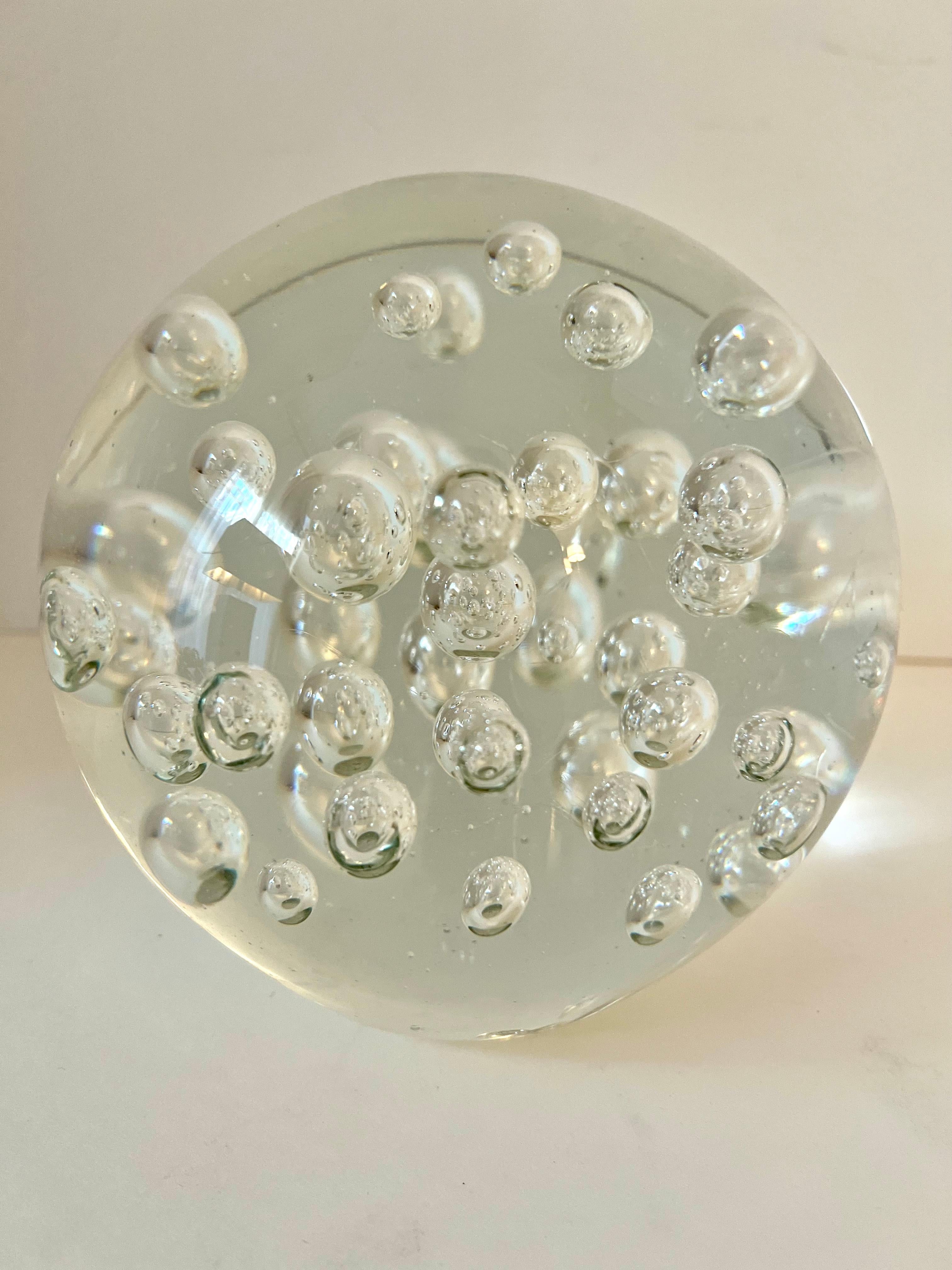 large glass paperweight with bubbles