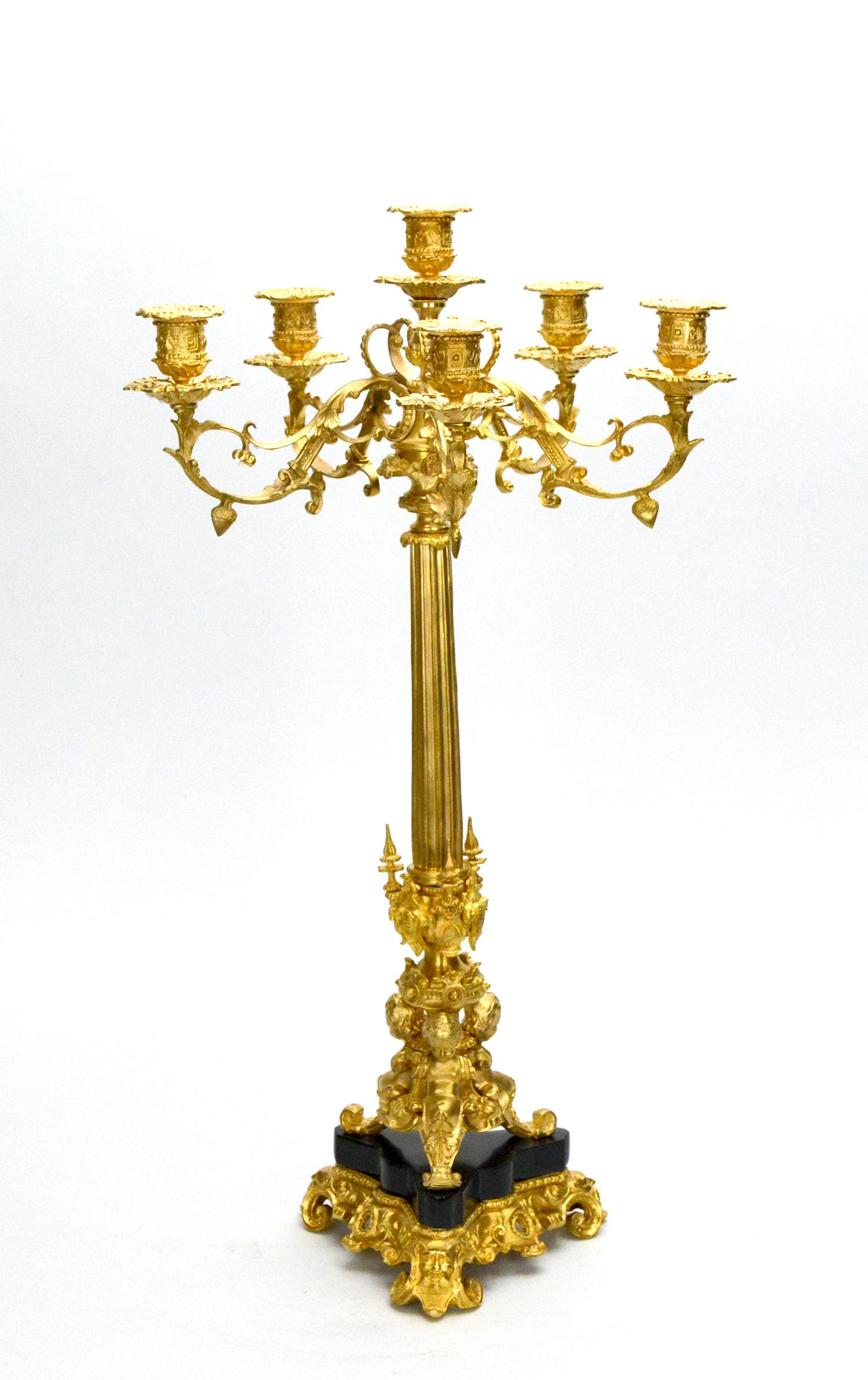 Pair of 6 light gold plated cherub marble Empire bronze candelabra

Here we are offering a pair of beautiful gold plated beautiful 6 light cherub marble Stand Empire bronze candelabra. It's made of solid bronze with black marble base. It holds up