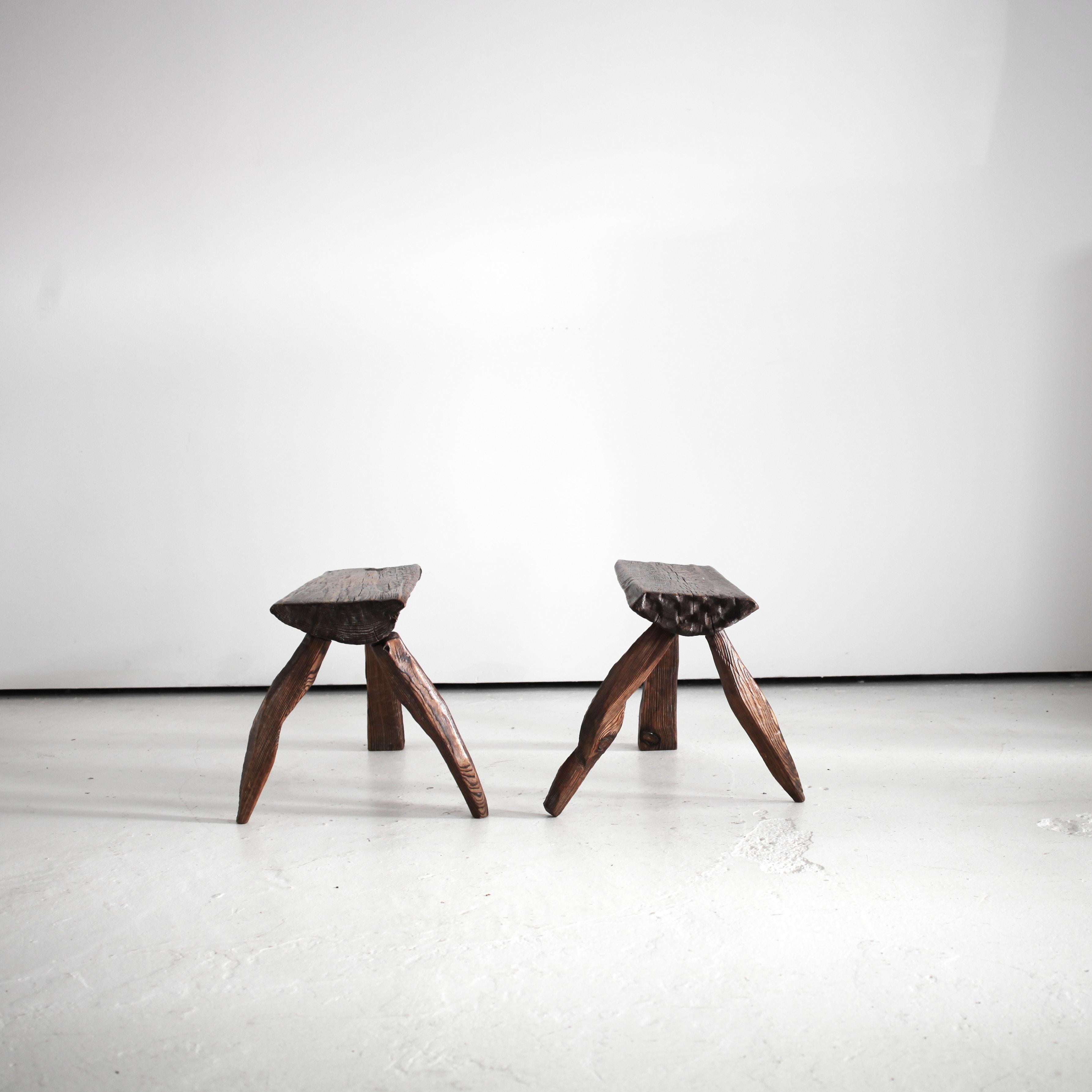 A Pair of pine artist made stools from Warsaw.

Distinctly carved in the Polish brutalist style.