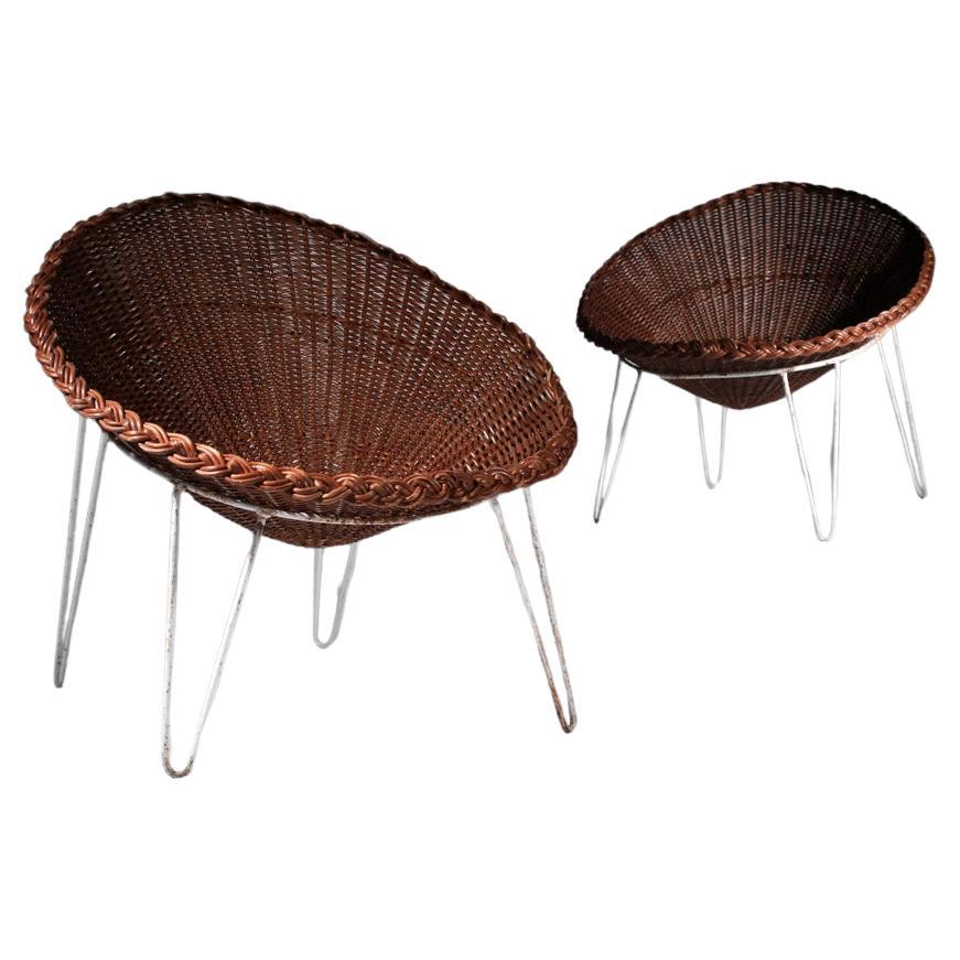 Paire de fauteuils en rotin français des années 60. Structure en rotin tressé teinté (d'origine) et 