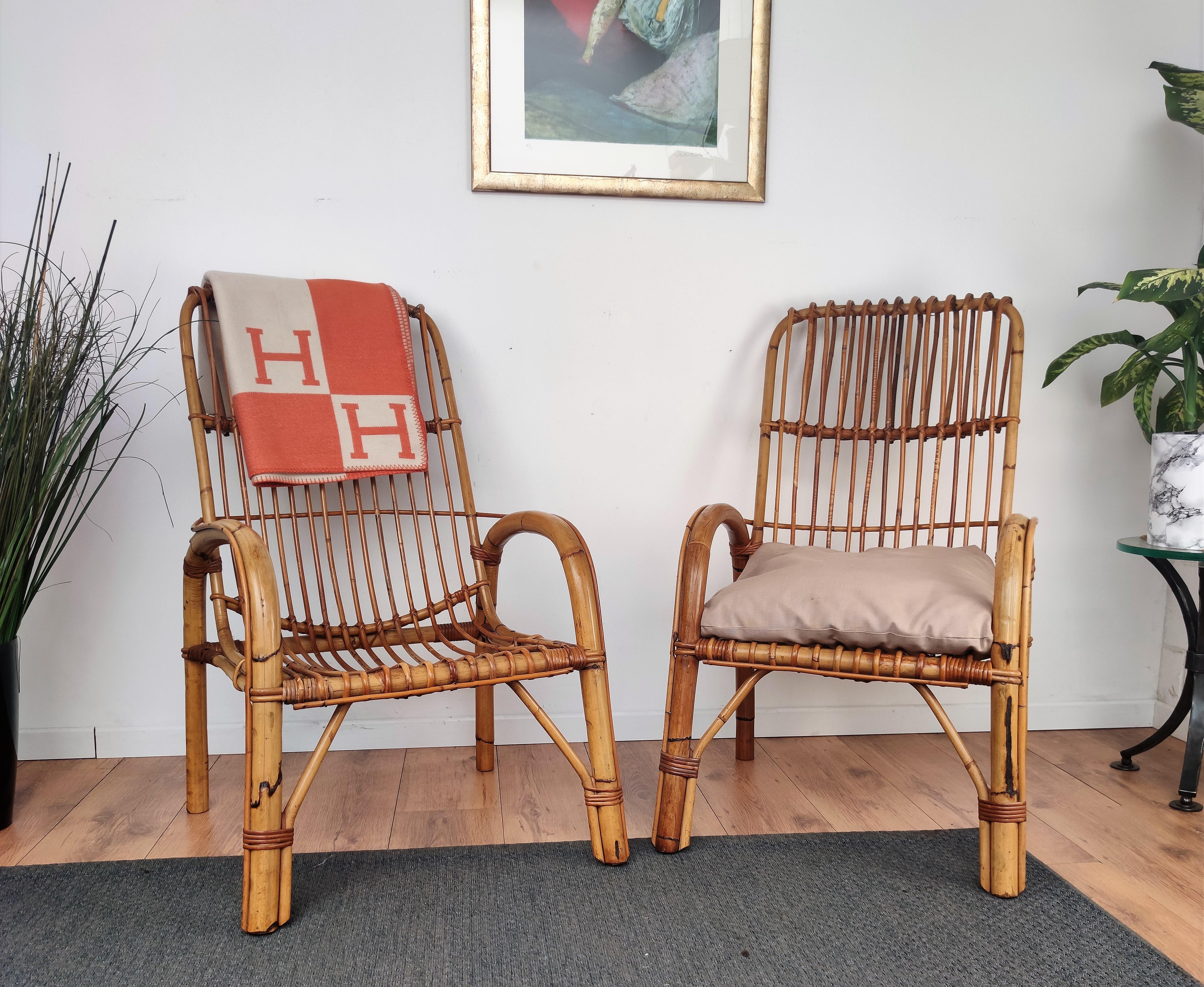 Beautiful 1960s Italian Mid-Century Modern pair of armchairs in rattan wicker bamboo with great design and tall high back. This charming lounge chairs are in the typical style of Franco Albini and Adrien Audoux where the organic beauty of the woven