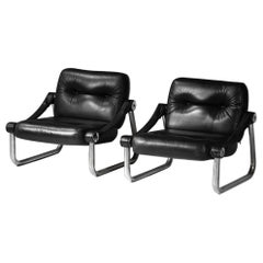 Pareja de sillones de cuero y acero tubular cromado de los años 60